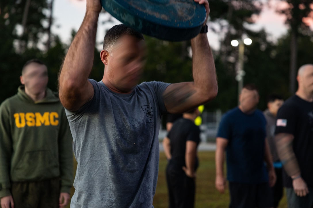 Marine Forces Special Operations Command hosts an Honor Workout recognizing all fallen Marine Raiders who passed away during the month of October at Camp Lejeune, North Carolina, Oct. 6, 2022. Command personnel participated in a moment of silence to pay tribute to those who lost their lives before competing in a team competition centered on physical and cognitive exercises. (U.S. Marine Corps photo by Sgt. Brennan Priest)