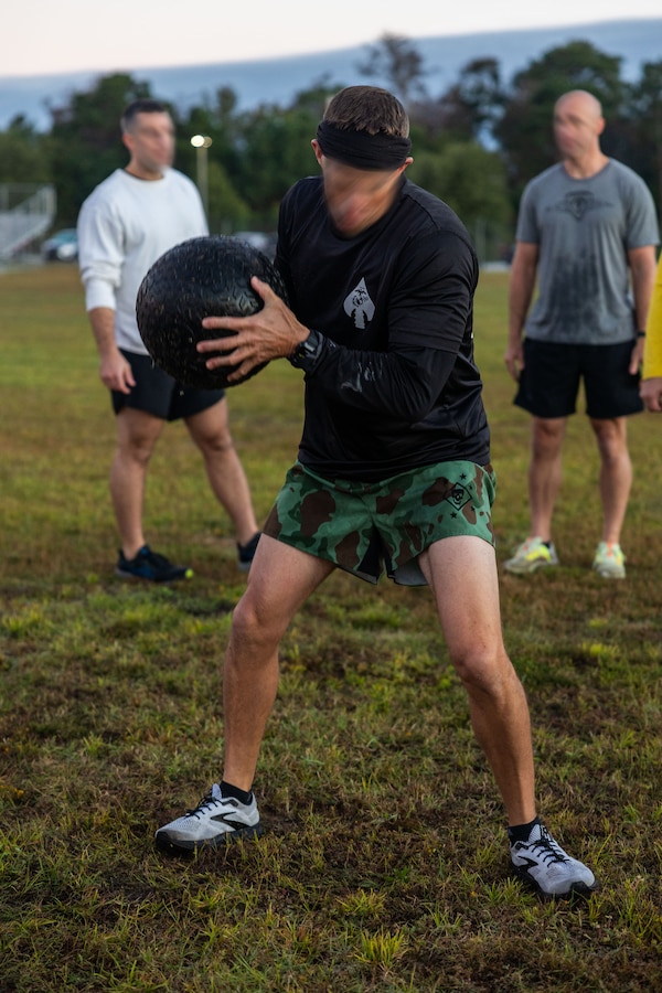 Marine Forces Special Operations Command hosts an Honor Workout recognizing all fallen Marine Raiders who passed away during the month of October at Camp Lejeune, North Carolina, Oct. 6, 2022. Command personnel participated in a moment of silence to pay tribute to those who lost their lives before competing in a team competition centered on physical and cognitive exercises. (U.S. Marine Corps photo by Sgt. Brennan Priest)