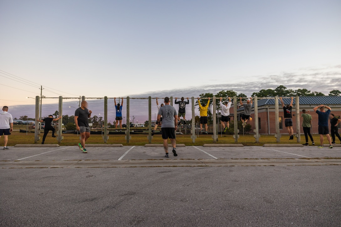 Marine Forces Special Operations Command hosts an Honor Workout recognizing all fallen Marine Raiders who passed away during the month of October at Camp Lejeune, North Carolina, Oct. 6, 2022. Command personnel participated in a moment of silence to pay tribute to those who lost their lives before competing in a team competition centered on physical and cognitive exercises. (U.S. Marine Corps photo by Sgt. Brennan Priest)