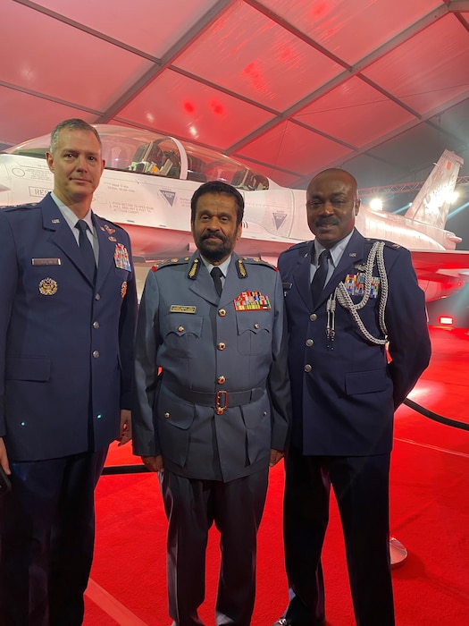 Three airmen posing for a photo