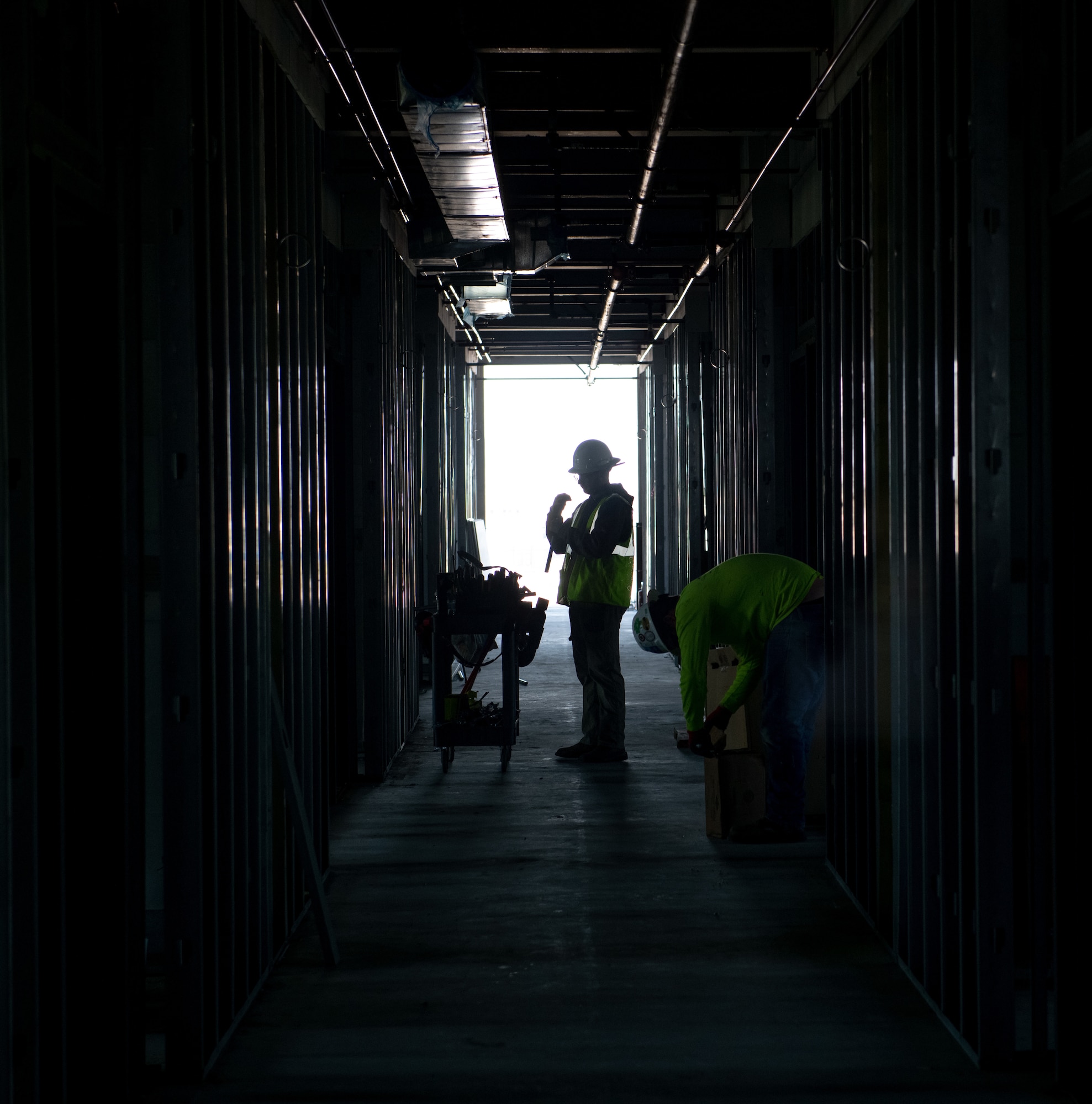 A construction worker grabs materials