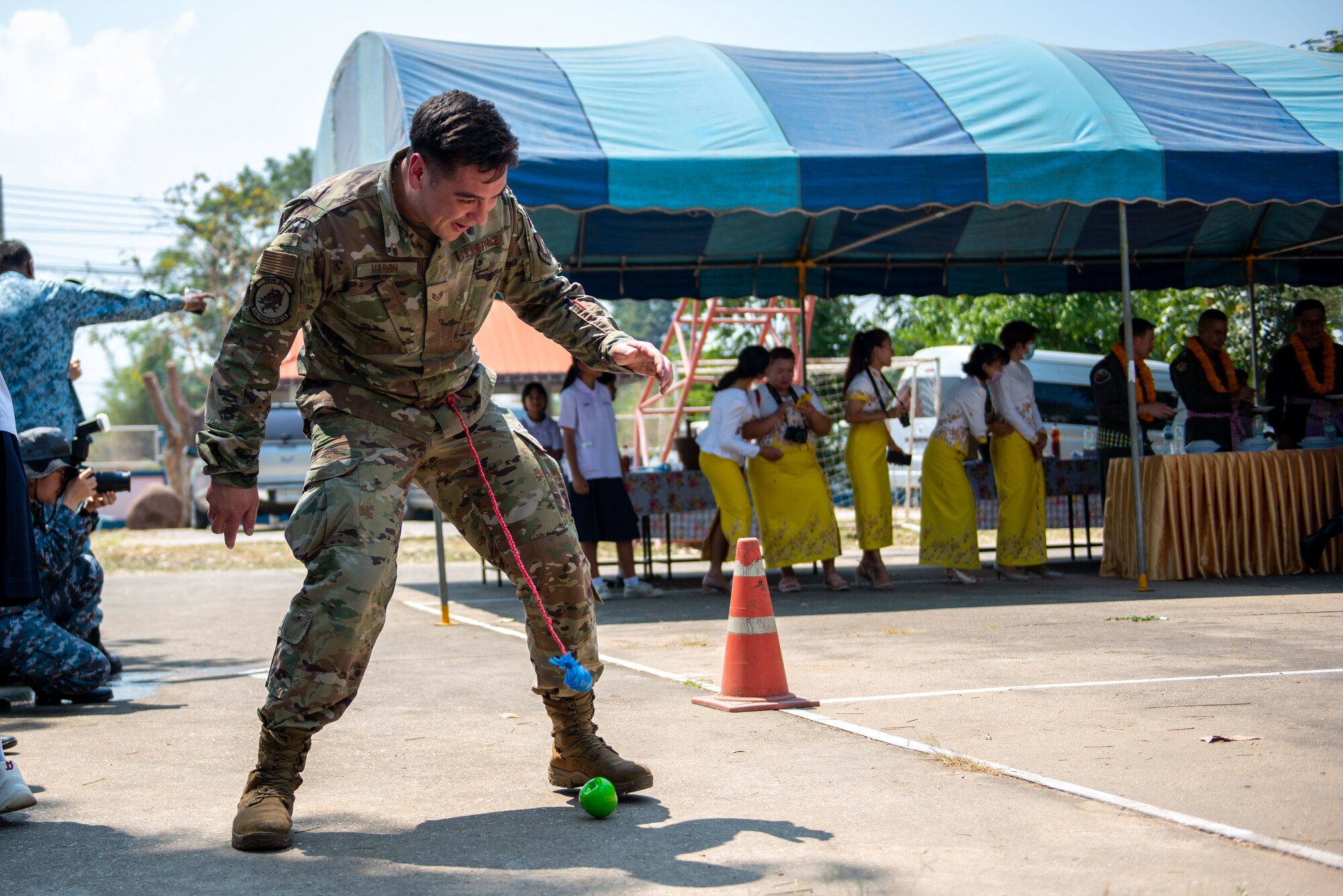 Photo of U.S. Air Force Staff Sgt playing a game during an event in Thailand