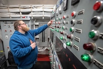 Austin Angle, Shop 99, Temporary Services, pumpwell team, monitors flooding operations inside the caisson at Dry Dock 2 while preparing for a 2019 submarine docking, at Puget Sound Naval Shipyard & Intermediate Maintenance Facility in Bremerton, Washington. (U.S. Navy photo by Scott Hansen)