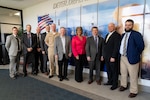 A group of people together, smiling for a picture.