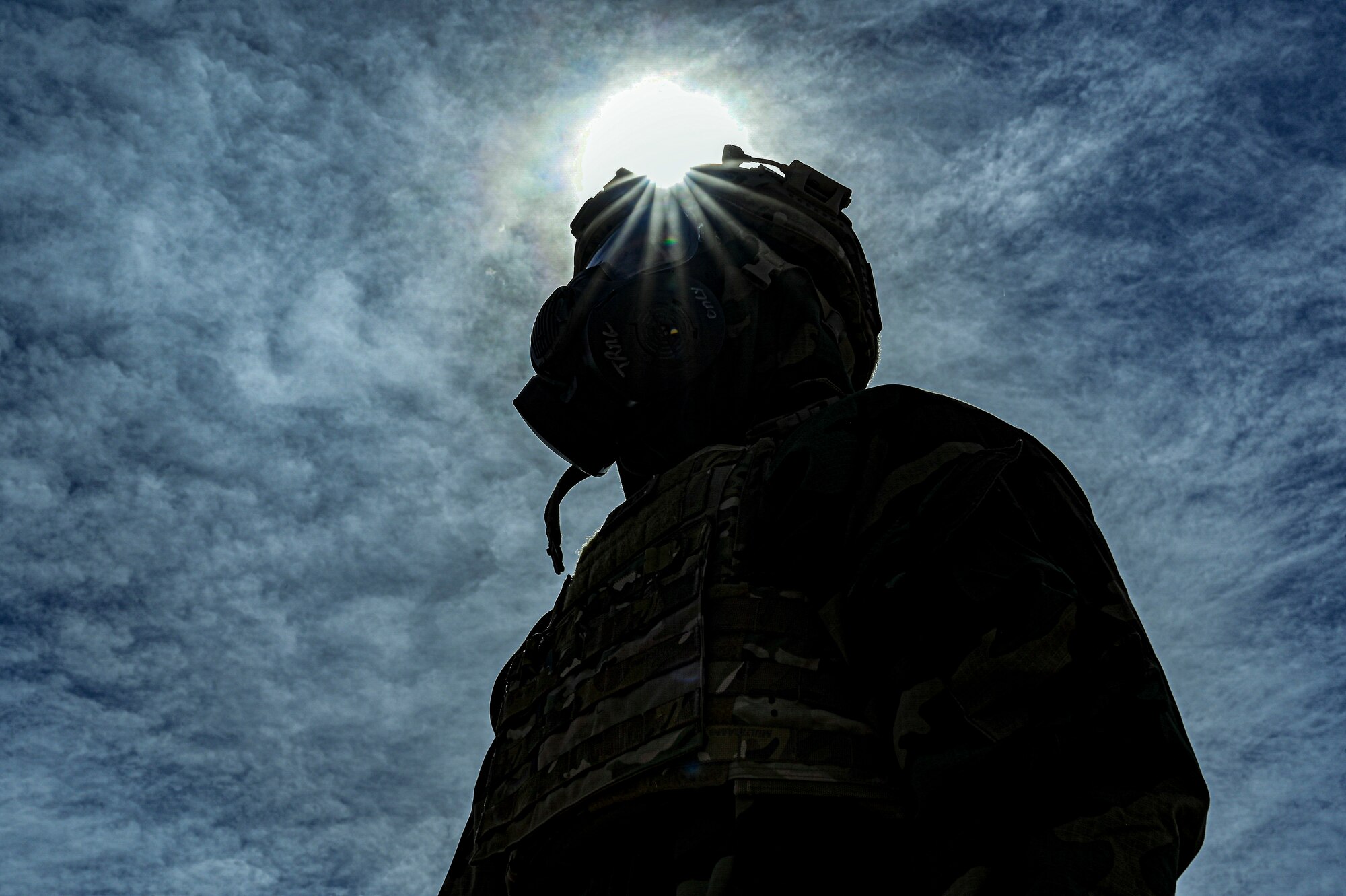 U.S. Air Force Airman 1st Class Jacob Breitbarth, 49th Civil Engineer Squadron explosive ordnance disposal apprentice, poses in full Mission Oriented Protective Posture gear during a chemical munition decontamination exercise at Holloman Air Force Base, New Mexico, March 23, 2023. The 49th CES EOD flight is trained to disarm and dispose of any explosives or chemicals that pose a threat to personnel on base. (U.S Air Force photo by Airman 1st Class Isaiah Pedrazzini)