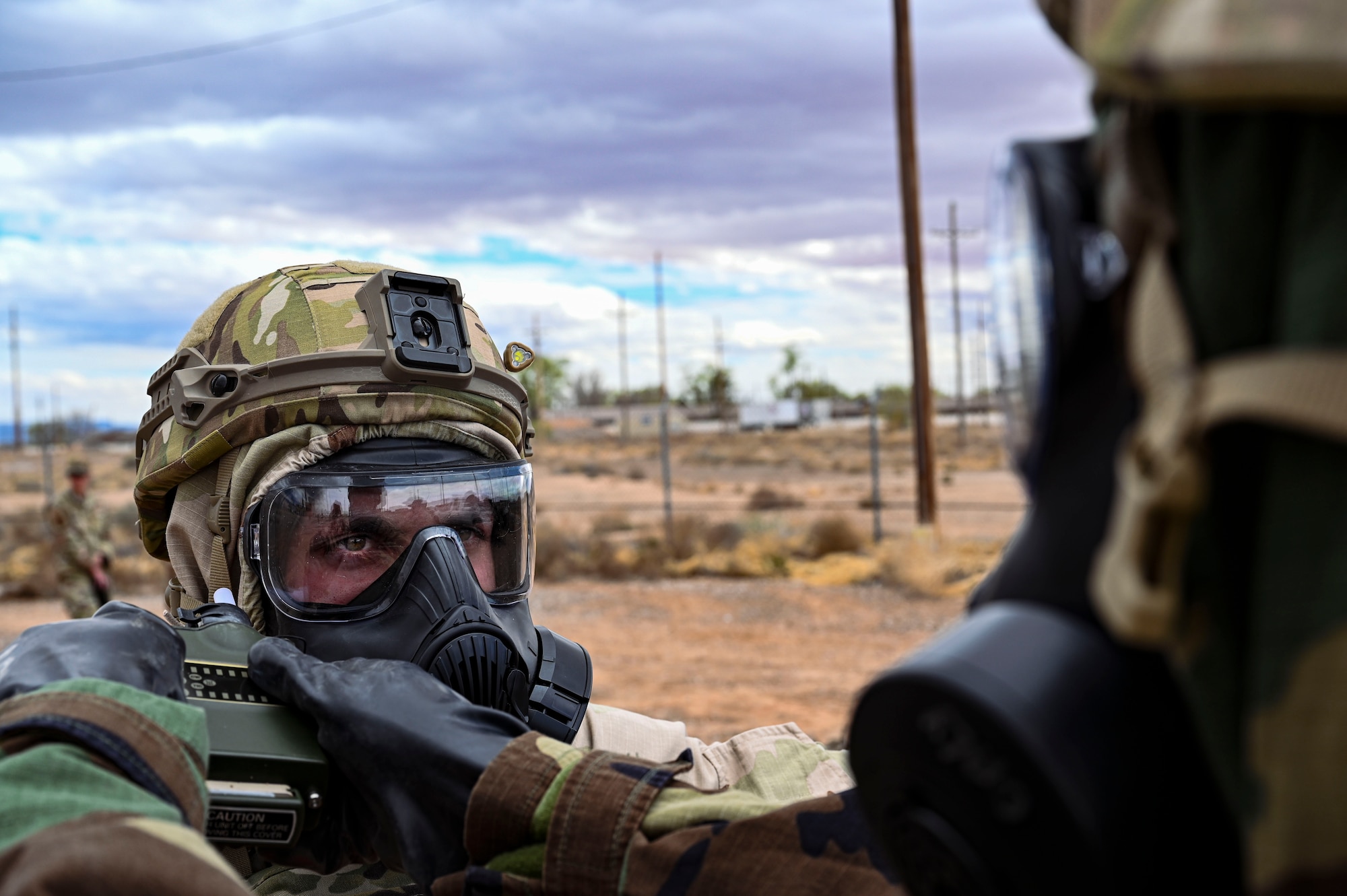 U.S. Air Force Airman 1st Class Spencer Pettingill, 49th Civil Engineer Squadron explosive ordnance disposal apprentice, is checked for any signs of hazardous material during a chemical munition decontamination exercise at Holloman Air Force Base, New Mexico, March 23, 2023. The 49th CES EOD flight constantly trains for different scenarios to better prepare for any extreme situations that they may encounter. (U.S Air Force photo by Airman 1st Class Isaiah Pedrazzini)