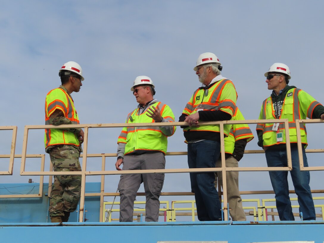 Team members gather to discuss construction program at a FUSRAP site in Deepwater, New Jersey