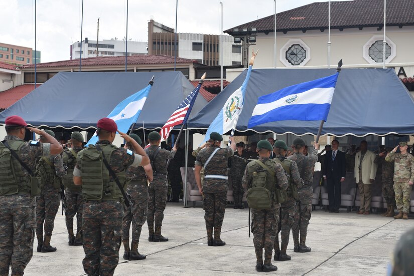 Service members from El Salvador, Guatemala, and Honduras present participating nations flags during the closing ceremony of CENTAM GUARDIAN in Guatemala City, Guatemala Mar 27, 2023. CENTAM GUARDIAN is an annual exercise designed to build humanitarian assistance/disaster response functional capacity, enhance readiness to combat common threats, and promote cooperation and interoperability between participating forces.