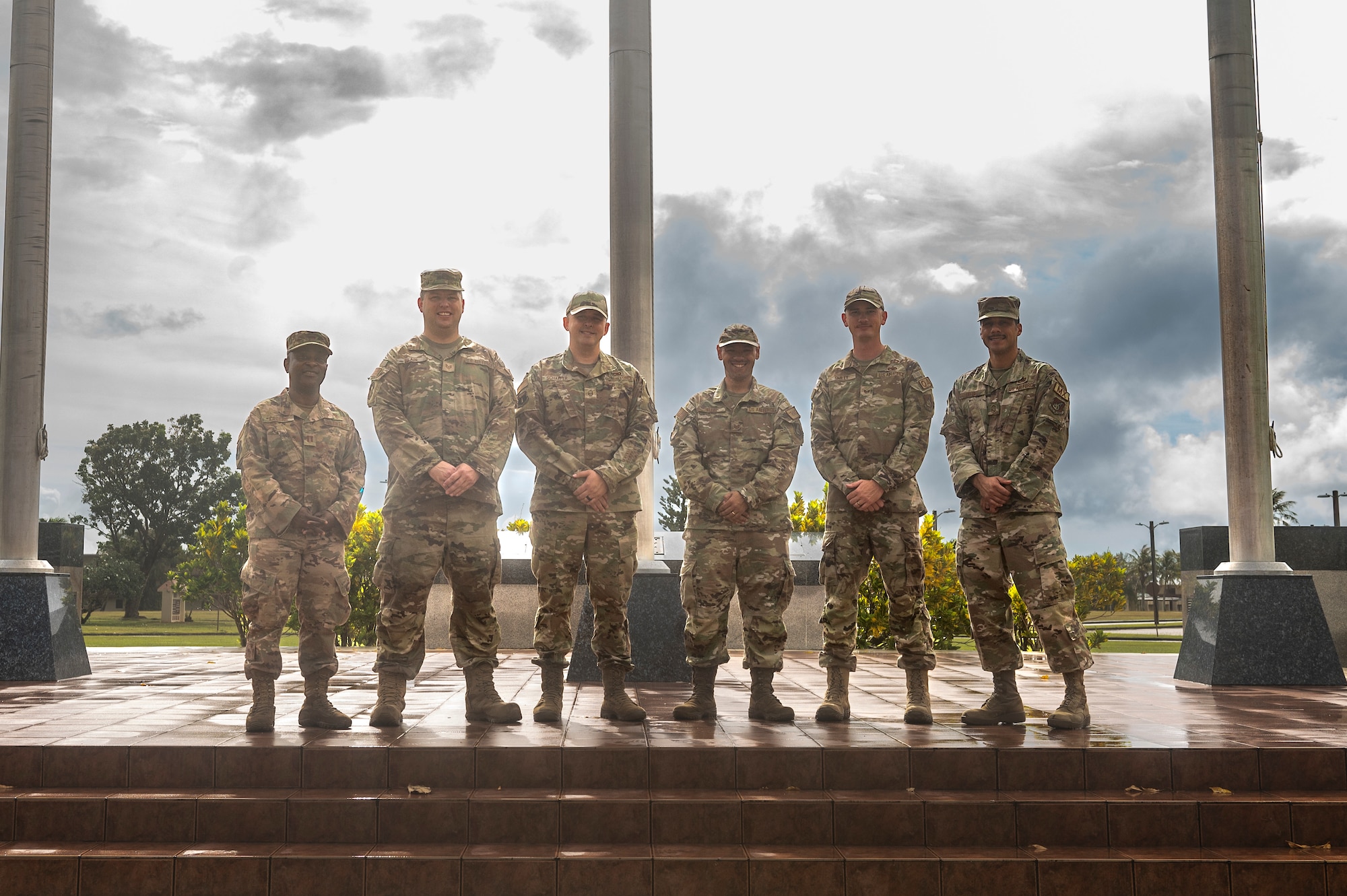 U.S. Air Force members and instructors for the Financial Peace University course, pose for a group photo on Andersen Air Force Base, Guam, March 21, 2023. The FPU course was a nine-week course that covered nine main lessons including cash flow planning, dumping debt, the role of insurance, retirement and college planning, real estate and mortgages. (U.S. Air Force photo by Airman 1st Class Spencer Perkins)