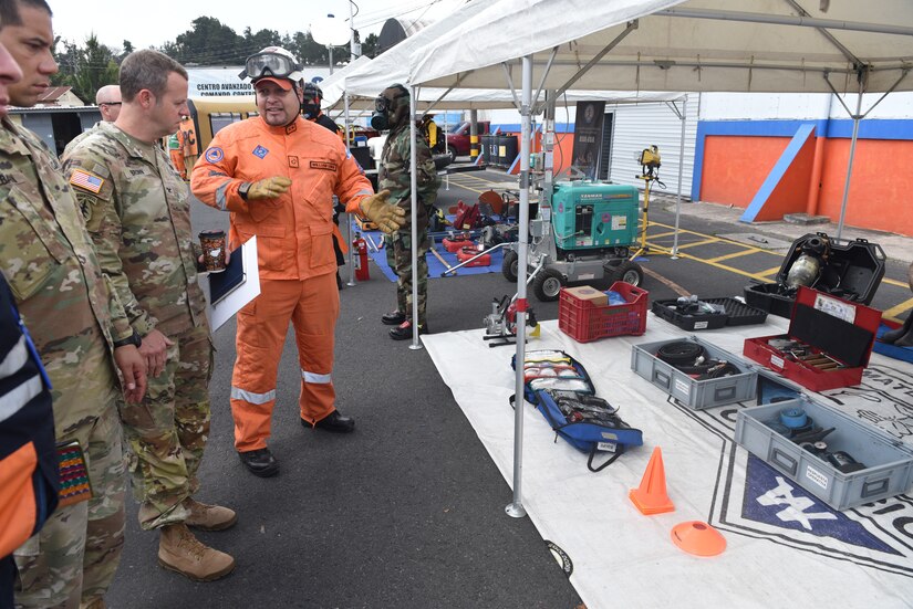 U.S. Army COL Phillip Brown, Joint Task Force commander, listens to one of the briefers from Coordinadora Nacional Para La Reduccion de Desastres (COMRAD) about some of the equipment utilized in their rescue efforts Mar 28, 2023. Joint Task Force Bravo Commander visits with regional partners and Civil Affairs teams in Guatemala from 22 - 29 March 2023 to reaffirm the task forces commitment to our regional partners and discuss how to strengthen respective partnerships.