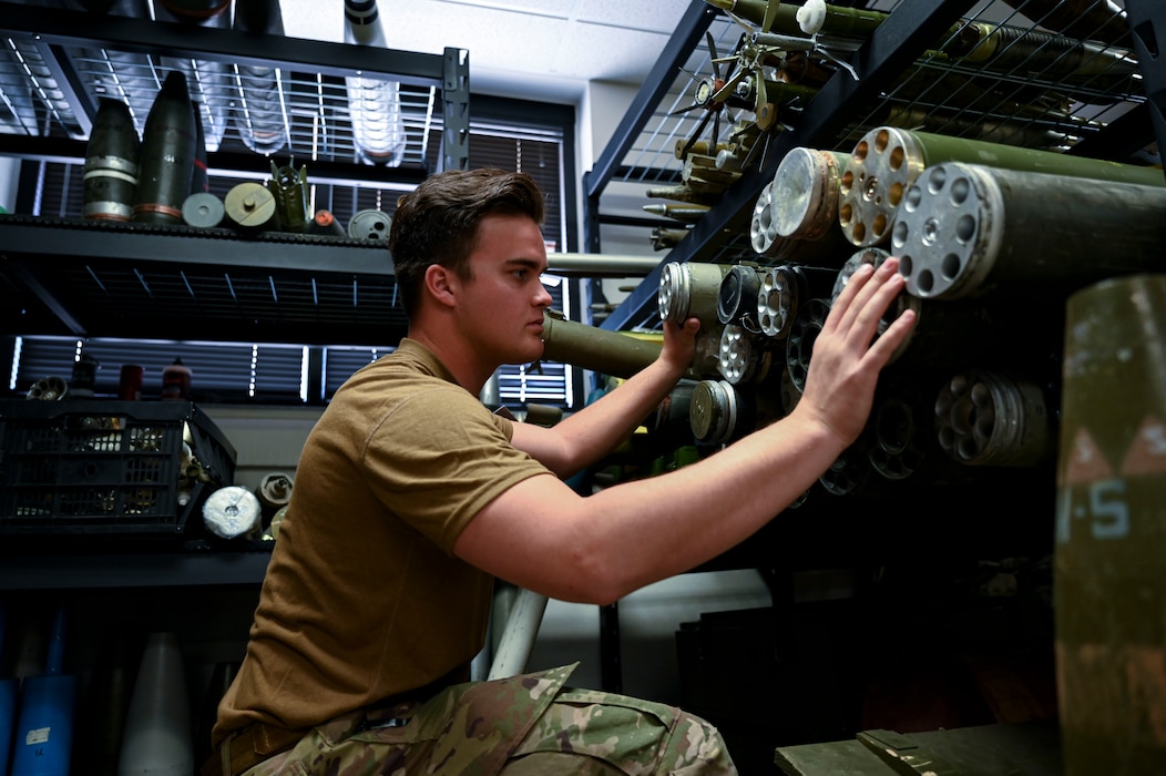 U.S. Air Force Airman 1st Class Ryan Lawson, 49th Civil Engineer Squadron explosive ordnance disposal apprentice, sorts through an array of mock explosive munitions at Holloman Air Force Base, New Mexico, March 23, 2023. The 49th CES EOD flight is trained to disarm and dispose of any explosives or chemicals that pose a threat to personnel on base. (U.S Air Force photo by Airman 1st Class Isaiah Pedrazzini)