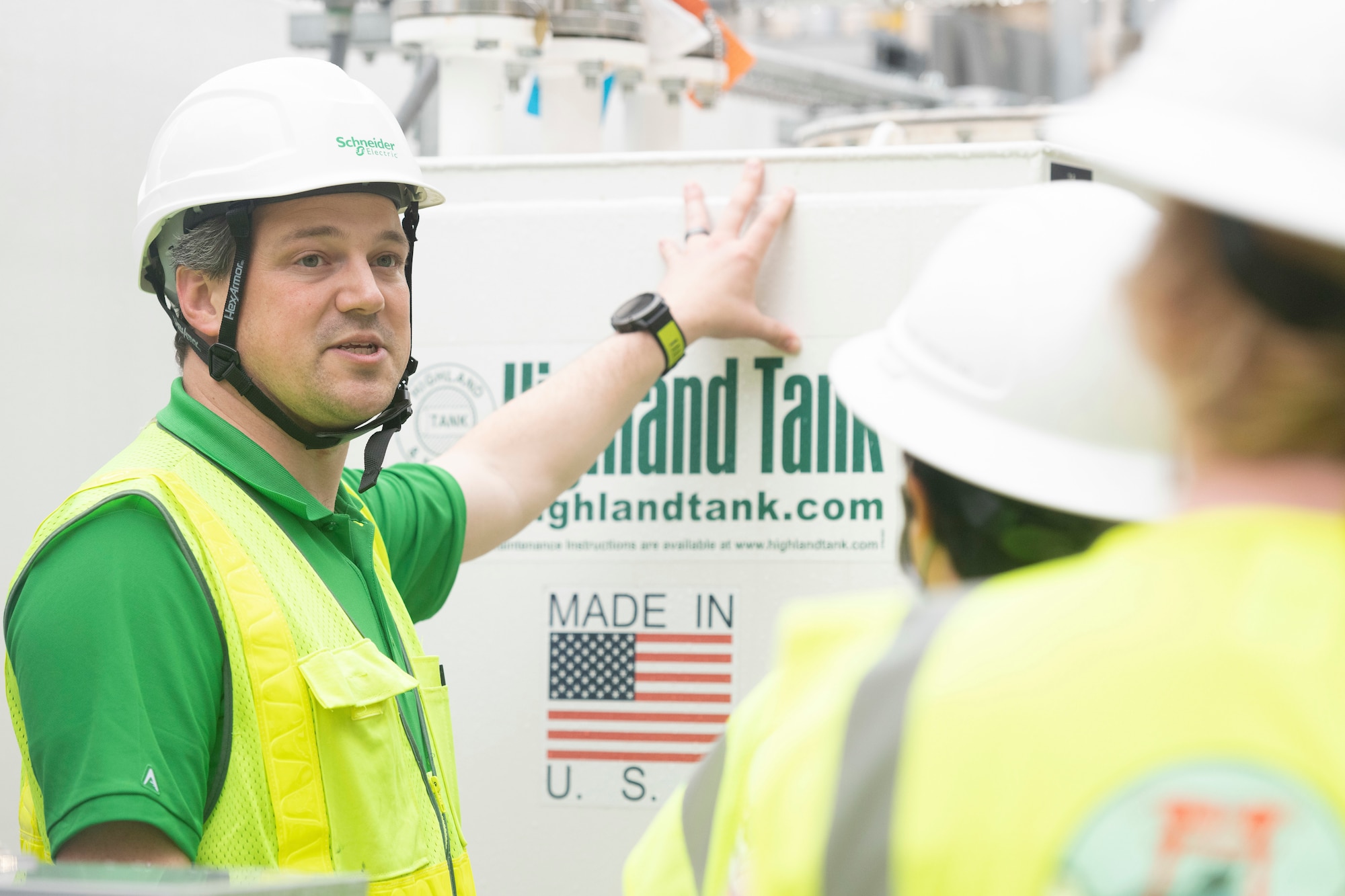 Nick Canton, left, Schneider Electric energy manager, briefs participant about the structure of the Combined Heating and Power (CHP) plant at Yokota Air Base, Japan, March 23, 2023.