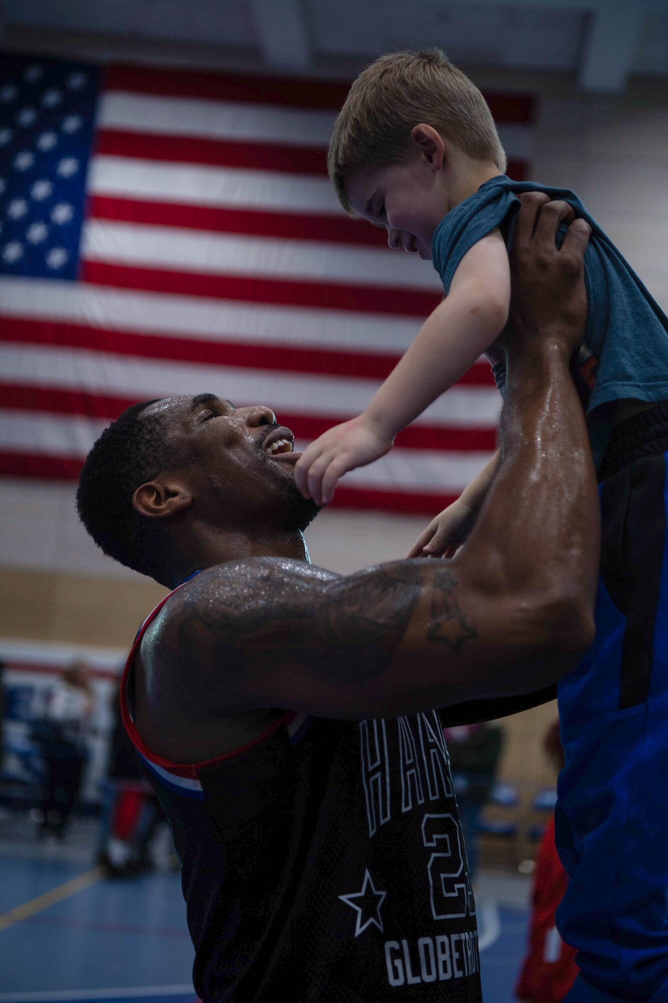 Harlem Globetrotters player Thunder Law engages with the Kaiserslautern Military Community during a meet and greet at Ramstein Air Base, Germany, March 24, 2023.