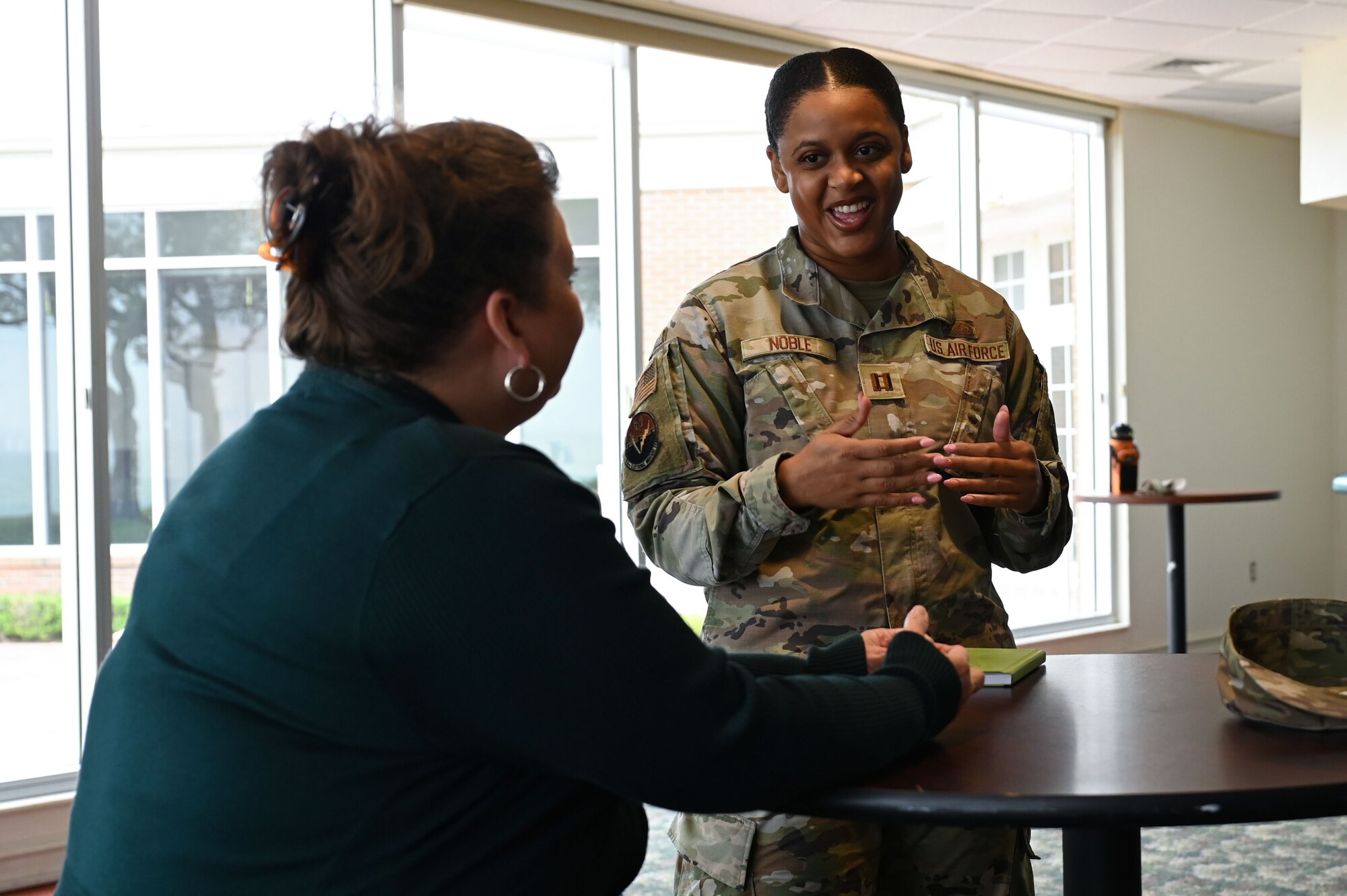 U.S. Air Force Captain Nemia Noble, 16th Electronic Warfare B-1 assistant flight commander, talks to Michelle Kerlin, 350th Spectrum Warfare Wing deputy director of staff, during the first 350th SWW Women’s history Month Symposium at Eglin Air Force Base, Fla., March 27, 2023. Female members from the wing had a chance to discuss their experiences as women while serving in the military. (U.S. Air Force photo by Staff Sgt. Ericka A. Woolever)