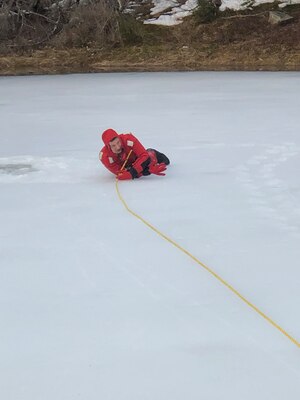 Rescuers haul the victim to safety during ice rescue training.