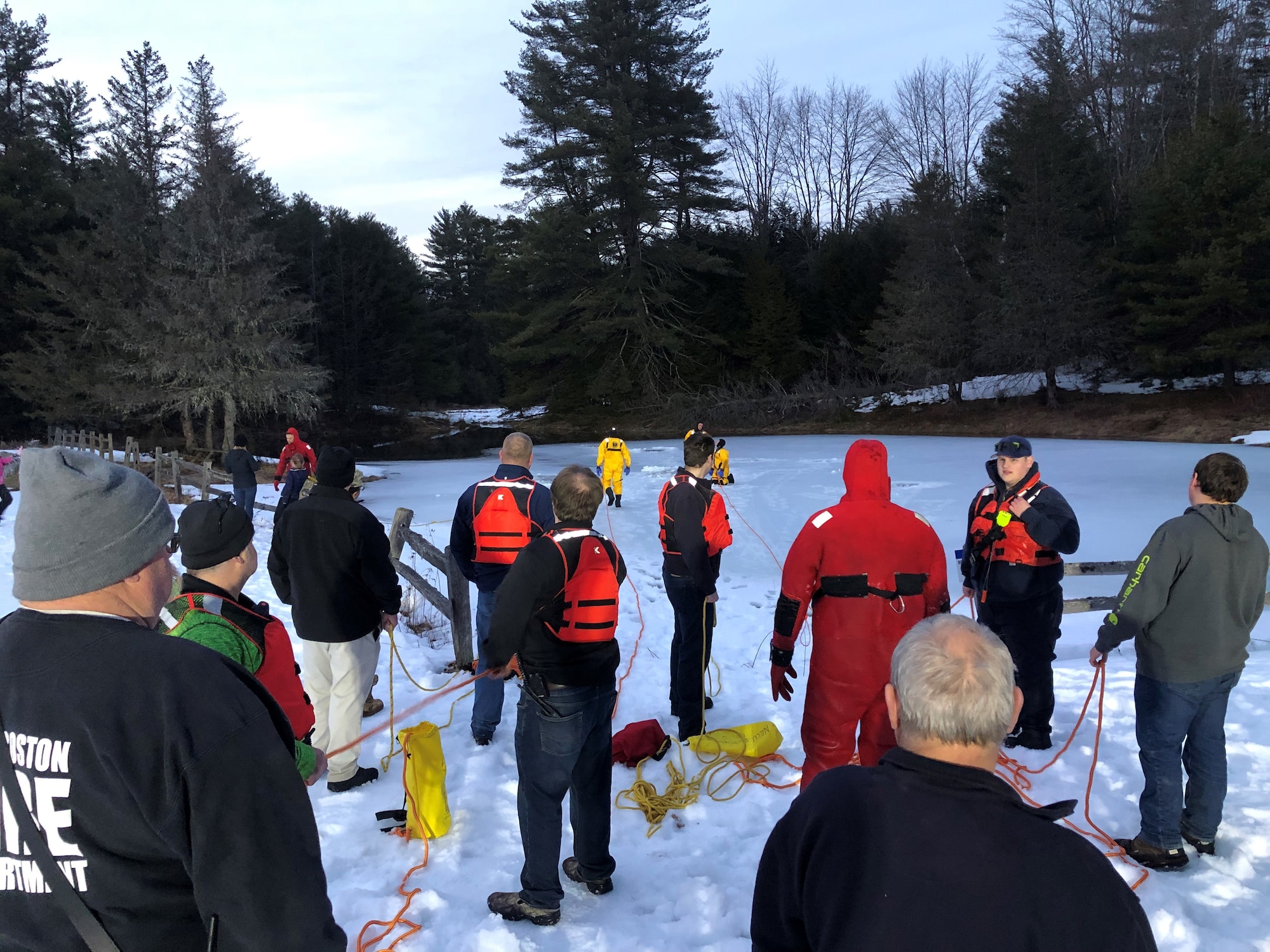 Firefighters gather at New Boston Space Force Station for ice rescue training.