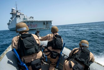 U.S. Navy Sailors from USS Paul Hamilton (DDG 60) approach the Italian navy frigate Carlo Bergamini (F 590) during a VBSS exercise in the Arabian Sea.