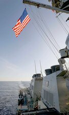 USS Milius (DDG 69) and USS Chung-Hoon (DDG 93), background, transit the South China Sea.
