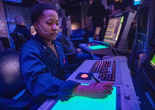 AC1 Shelley Reese plots aircraft landing paths aboard USS George H.W. Bush (CVN 77) in the Tyrrhenian Sea.