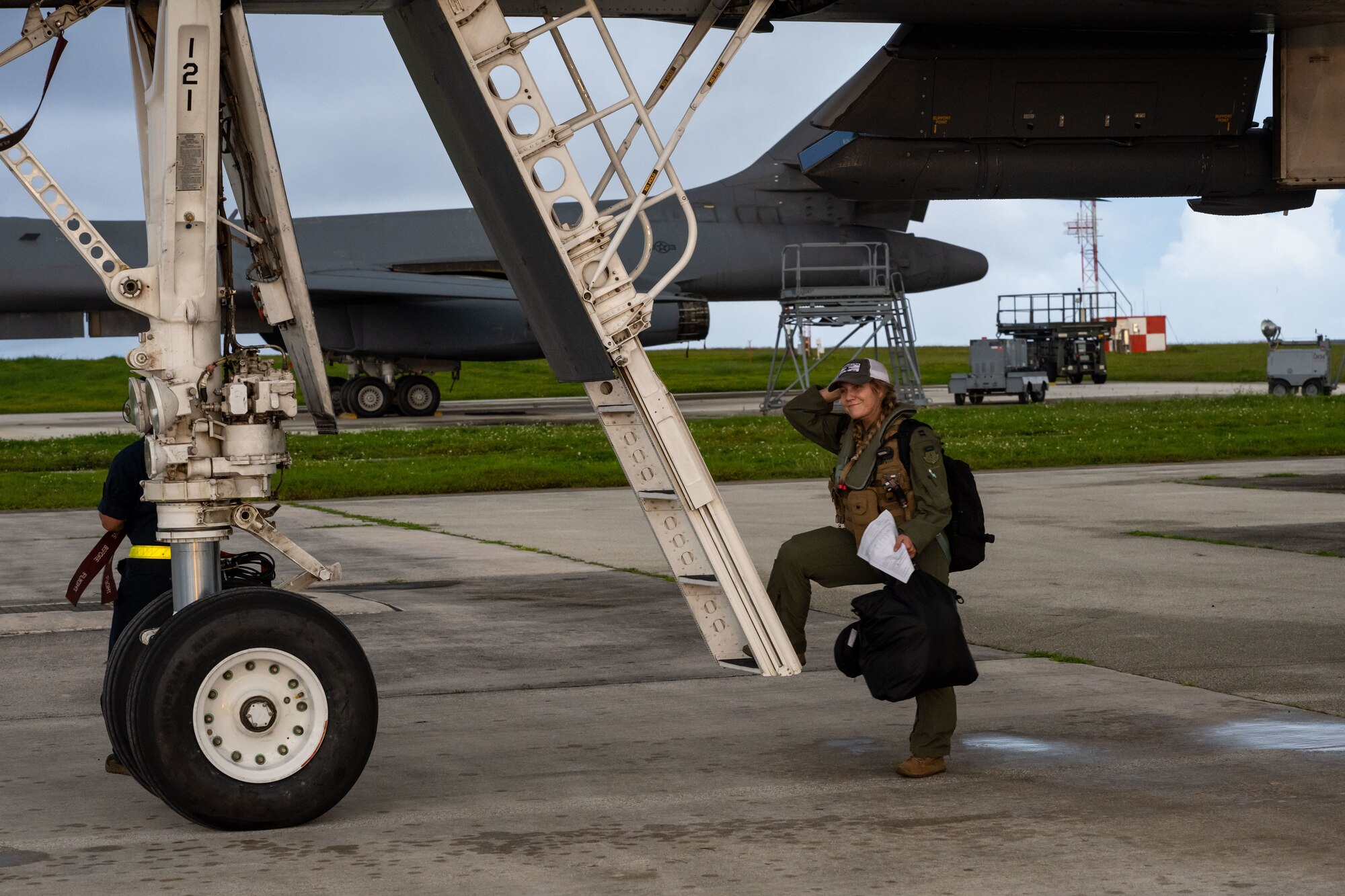 U.S. Air Force Capt. Sarah Brandt, a weapons systems operator with the 28th Bomb Wing at U.S. Air Force Capt. Sarah Brandt, a 37th Expeditionary Bomb Squadron weapons systems operator assigned to Ellsworth Air Force Base, South Dakota, exits a B-1B Lancer at Andersen Air Force Base, Guam, Oct. 19, 2022. The United States promotes freedom of navigation and other internationally lawful uses of the sea and international airspace. (U.S. Air Force photo by Airman 1st Class Adam Olson)