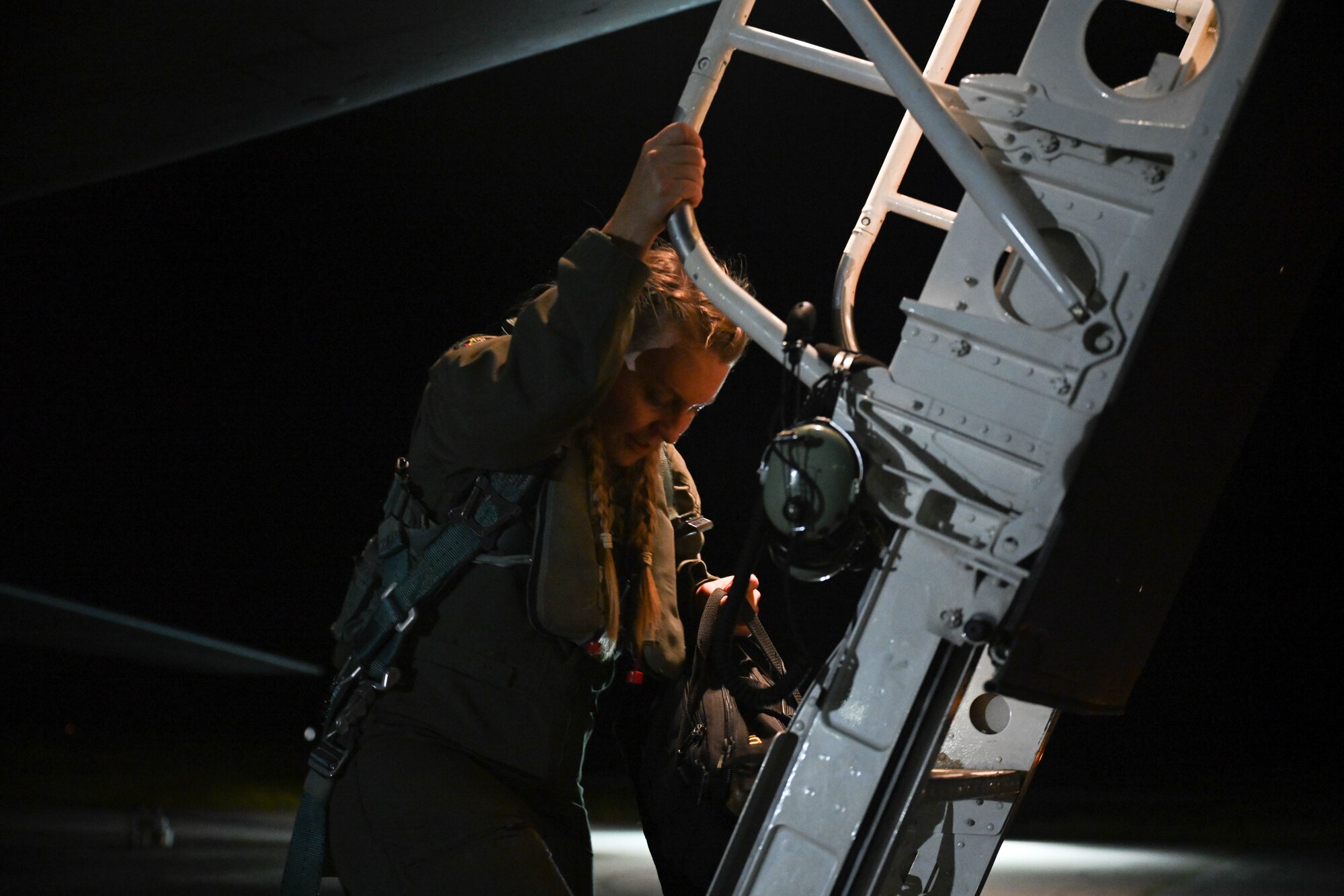 U.S. Air Force Capt. Sarah Brandt, an instructor weapon systems operator assigned to the 37th Expeditionary Bomb Squadron, Ellsworth Air Force Base, South Dakota, exits a B-1B Lancer after a Bomber Task Force mission at Andersen AFB, Guam, Nov. 14, 2022. BTF missions are designed to showcase Pacific Air Force’s ability to deter, deny and dominate any influence or aggression from adversaries or competitors. (U.S. Air Force photo by Staff Sgt. Hannah Malone)