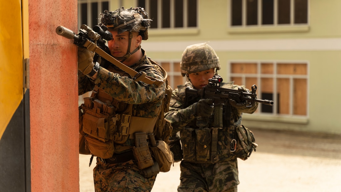 A U.S. Marine with 3rd Battalion, 6th Marines and a Republic of Korea Marine with 3rd Battalion, 1st Regiment, 2nd Marine Division participate in a combined patrol during Korean Marine Exercise Program 23.3 at Rodriguez Live-fire Complex, Republic of Korea, March 28, 2023. KMEP is a series of continuous-combined training exercises designed to enhance the ROK-U.S. Alliance, promote stability on the Korean Peninsula, and strengthen combined military capabilities and interoperability. 3rd Battalion, 6th Marines is forward deployed in the Indo-Pacific under 4th Marines, 3rd Marine Division as part of the Unit Deployment Program.