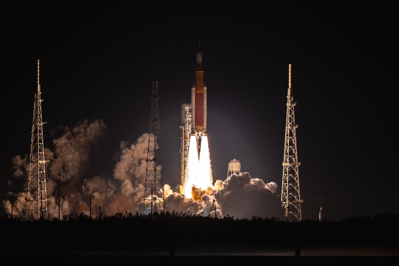 The Artemis I rocket lifts off from its launch pad.