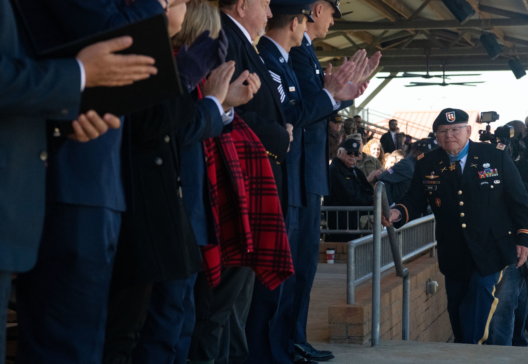 Gary Michael Rose Vietnam veteran and Medal of Honor recipient walks up stairs after giving speech. Rose was awarded the medal for gallantry while serving as a special forces medic.