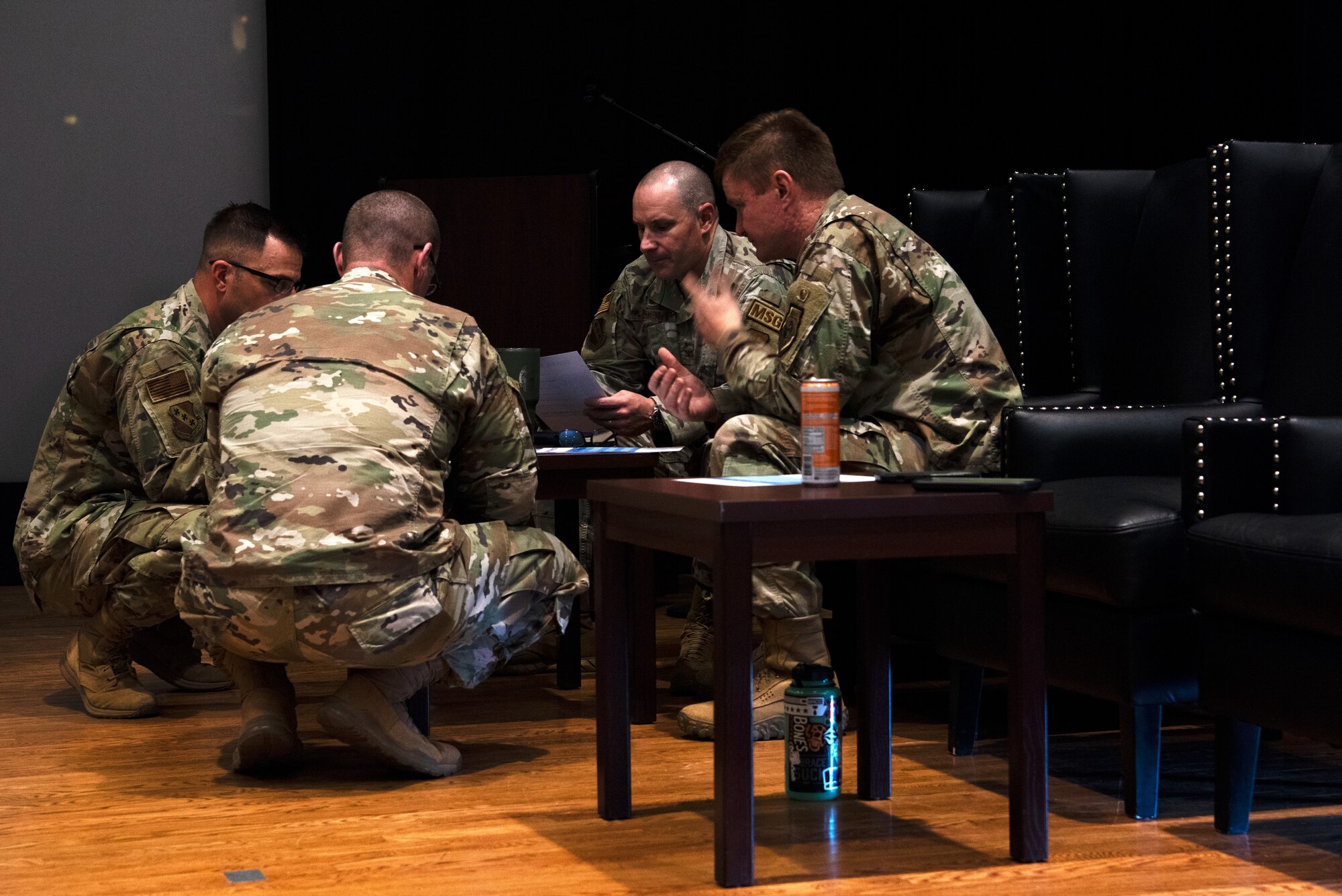Judges from the Dyess Spark Tank competition deliberate on the innovative ideas that presenters submitted on Dyess Air Force Base, Texas, March 24, 2023.