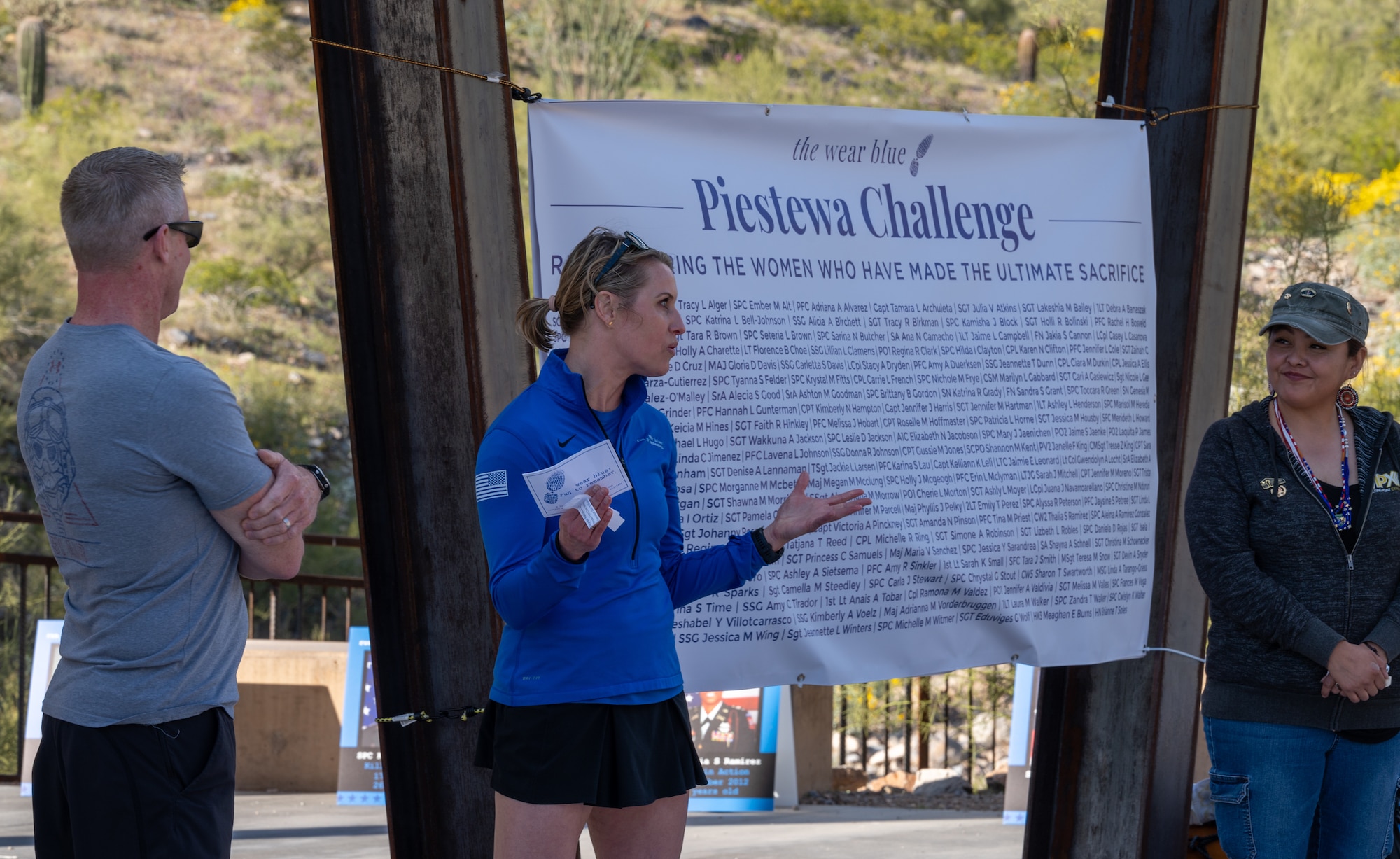 Lisa Hallet, Gold Star Spouse and executive director of the Wear Blue: Run to Remember speaks to participants of the Wear Blue: Run to Remember Piestewa Challenge March 26, 2023, at Piestewa Peak trailhead in Phoenix, Arizona.