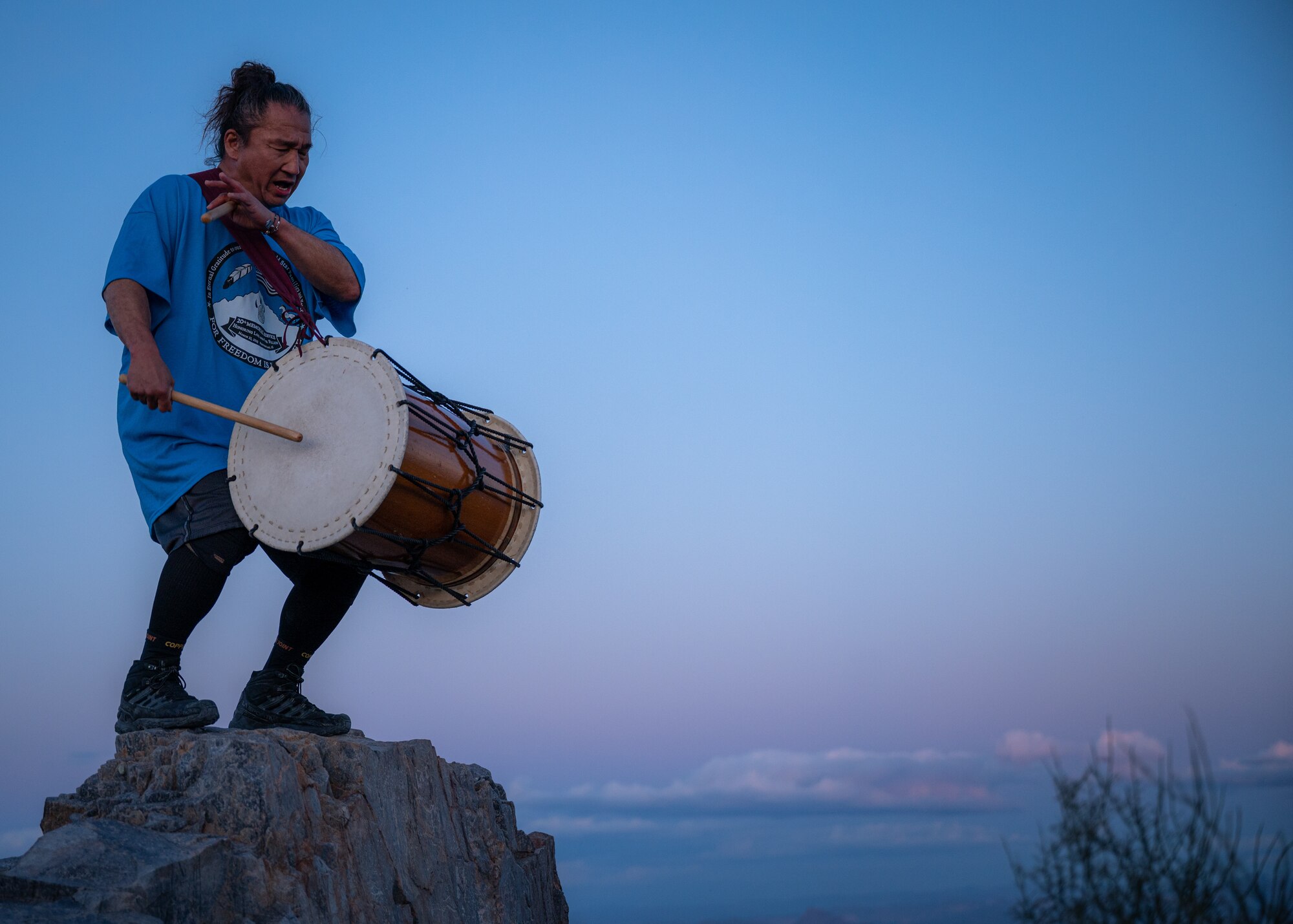 Ken Koshio, Taiko Japanese drumming artist plays music at the top of Piestewa Peak for participants of the Wear Blue: Run to Remember Piestewa Challenge March 26, 2023, at Piestewa Peak trailhead in Phoenix, Arizona.