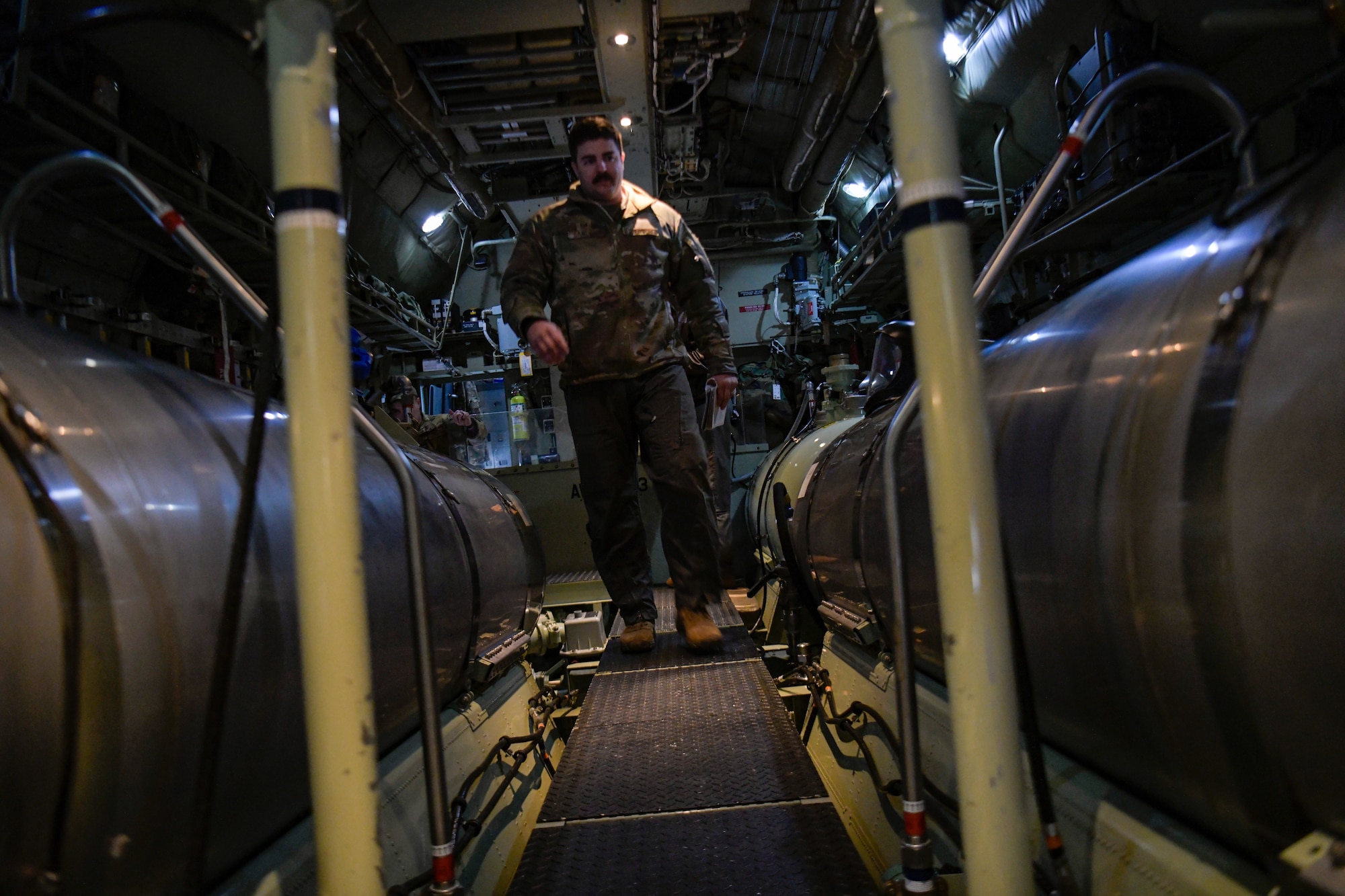 Tech. Sgt. Ethan Sanchez, an aerial spray qualified loadmaster assigned to the 757th Airlift Squadron, runs preflight checks on a modular aerial spray system aboard an aerial spray modified C-130H Hercules aircraft assigned to the 910th Airlift Wing, Youngstown Air Reserve Station, Ohio, on March 14, 2023, at Hill Air Force Base, Utah.