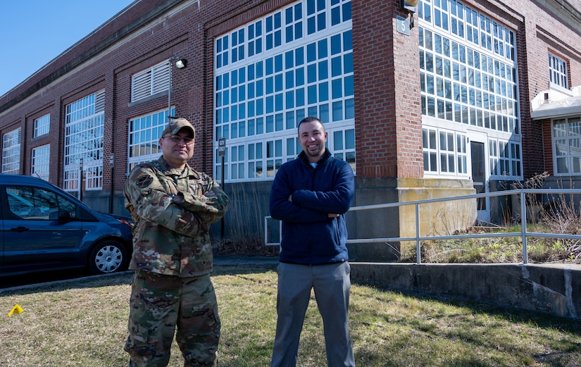 U.S. Air Force Master Sgt. Gabriel Lira, 787th CES senior enlisted leader and Robert Gullo, 787th Civil Engineer Squadron Geobase and Execution support chief, pose for a photo outside at Joint Base McGuire-Dix-Lakehurst, N.J., March 20, 2023. JB MDL is now equipped with a state-of-the-art online map system, Portal Maps, that is both innovative and efficient.
