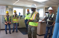 U.S. Army Medical Logistics Command Commander Col. Gary Cooper talks to team members from the U.S. Army Medical Materiel Agency’s APS-3 (medical) warehouse in Goose Creek, South Carolina, during an APS-3 site visit to the USNS Pomeroy (T-AKR 316) March 23, 2023. The engagement provided staff with insights into how and where medical materiel is stored on the roll on/roll off cargo ship as part of the Army Prepositioned Stocks, or APS, program. (Ellen Crown)