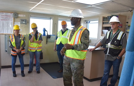 U.S. Army Medical Logistics Command Commander Col. Gary Cooper talks to team members from the U.S. Army Medical Materiel Agency’s APS-3 (medical) warehouse in Goose Creek, South Carolina, during an APS-3 site visit to the USNS Pomeroy (T-AKR 316) March 23, 2023. The engagement provided staff with insights into how and where medical materiel is stored on the roll on/roll off cargo ship as part of the Army Prepositioned Stocks, or APS, program. (Ellen Crown)