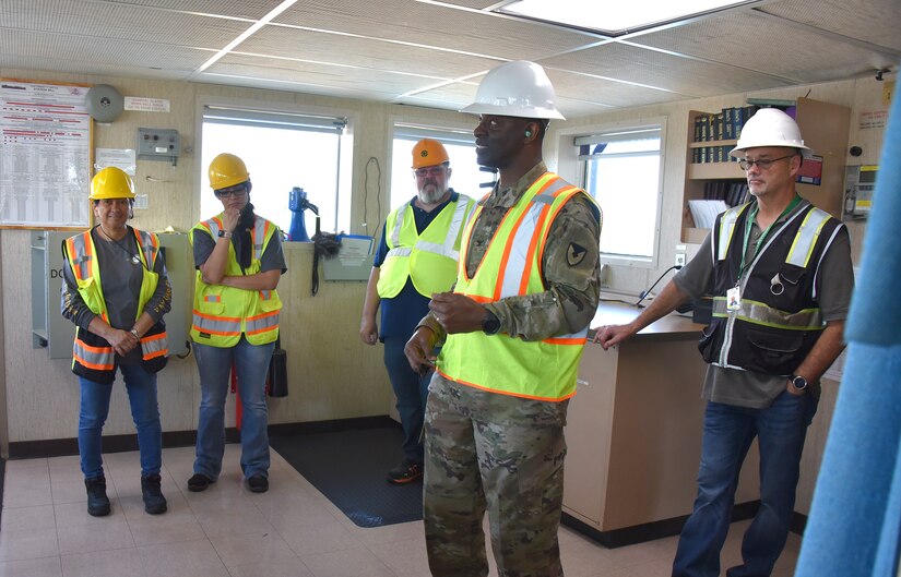 U.S. Army Medical Logistics Command Commander Col. Gary Cooper talks to team members from the U.S. Army Medical Materiel Agency’s APS-3 (medical) warehouse in Goose Creek, South Carolina, during an APS-3 site visit to the USNS Pomeroy (T-AKR 316) March 23, 2023. The engagement provided staff with insights into how and where medical materiel is stored on the roll on/roll off cargo ship as part of the Army Prepositioned Stocks, or APS, program. (Ellen Crown)