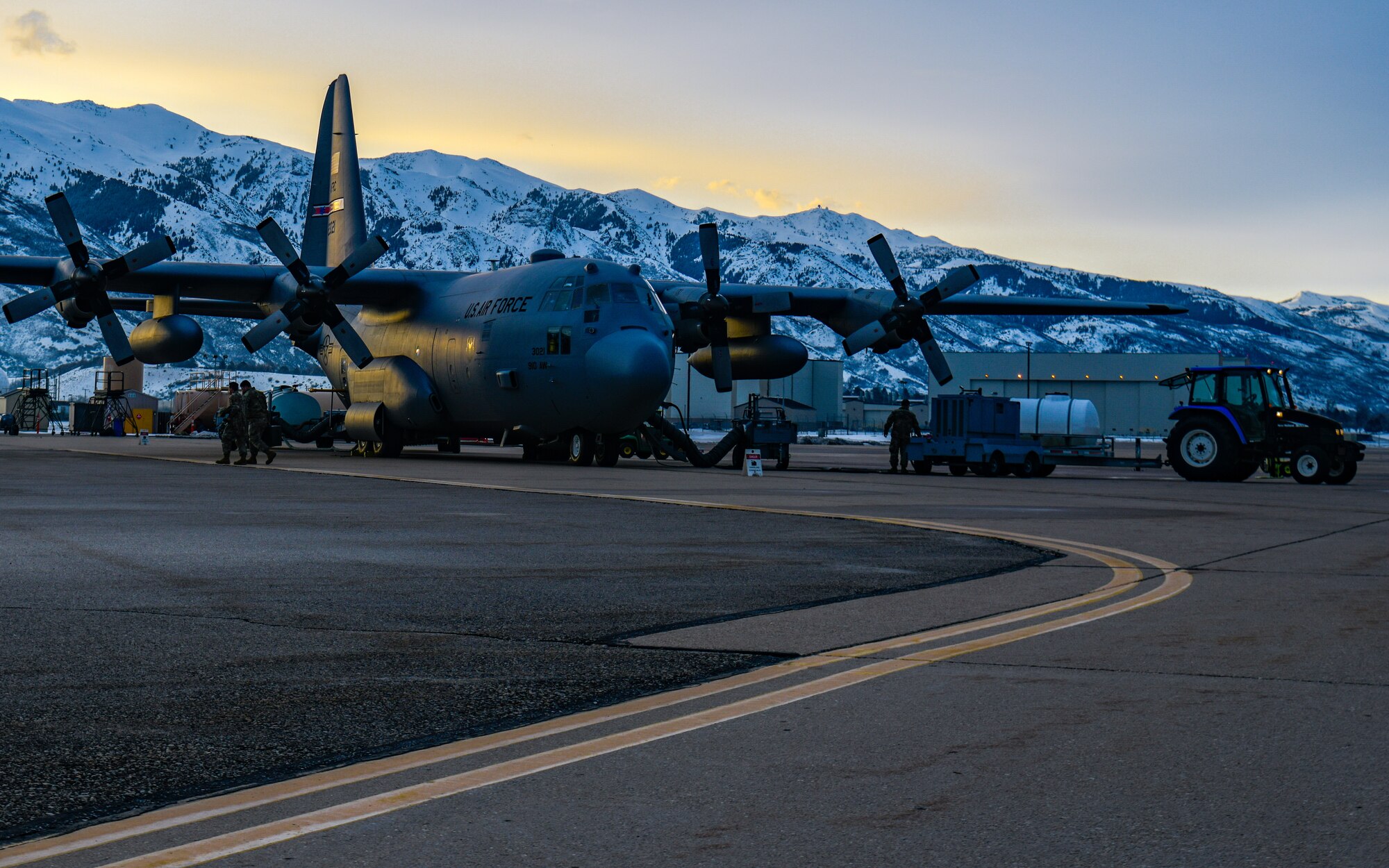 Aerial spray system maintainers assigned to the 910th Maintenance Squadron load product into an aerial spray-modified C-130H Hercules aircraft assigned to the 910th Airlift Wing, Youngstown Air Reserve Station, Ohio, on March 14, 2023, at Hill Air Force Base, Utah.