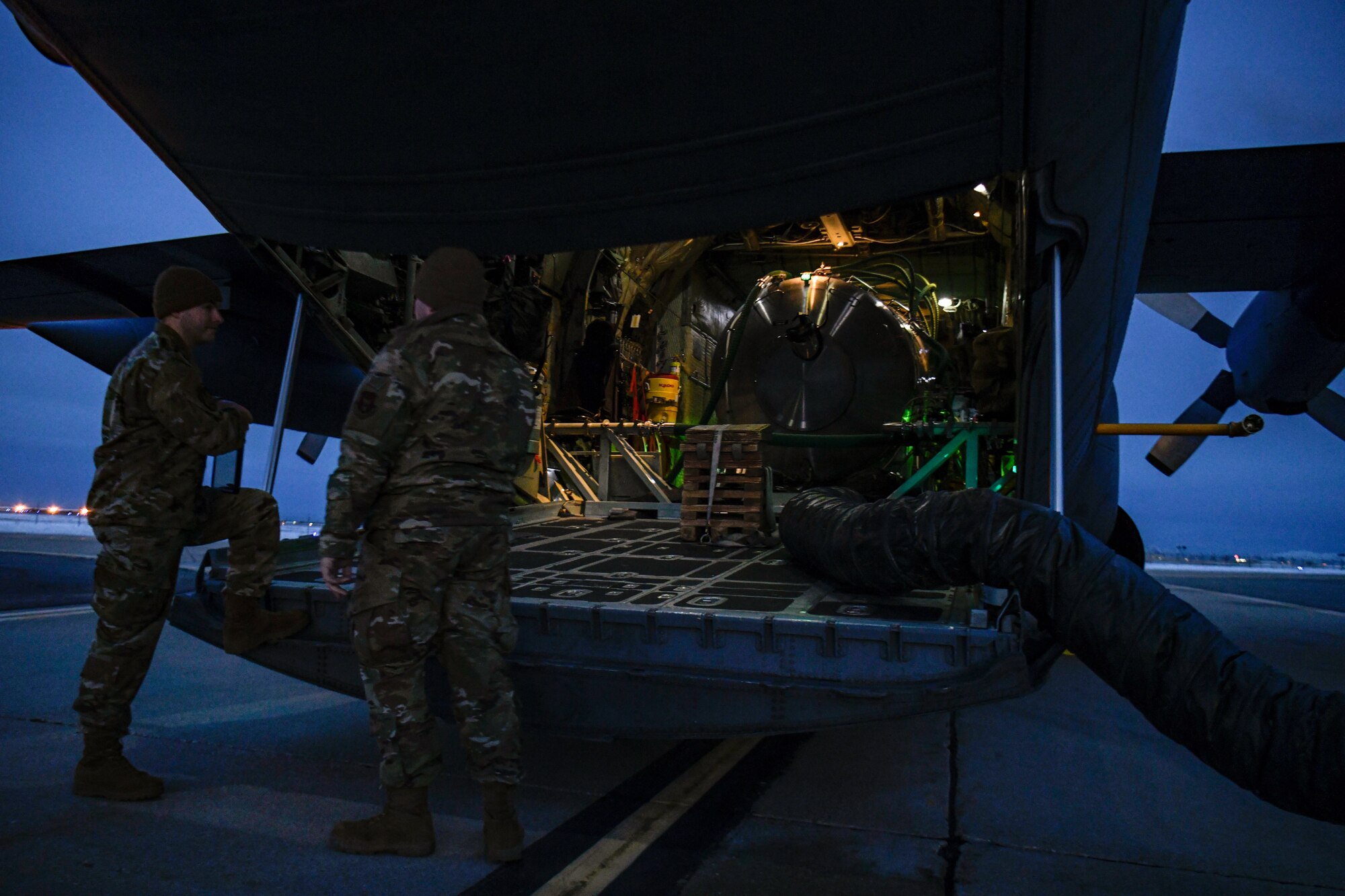 Aerial spray system maintainers assigned to the 910th Maintenance Squadron warm up the electrical systems of an aerial spray-modified C-130H Hercules aircraft assigned to the 910th Airlift Wing, Youngstown Air Reserve Station, Ohio, on March 14, 2023, at Hill Air Force Base, Utah.