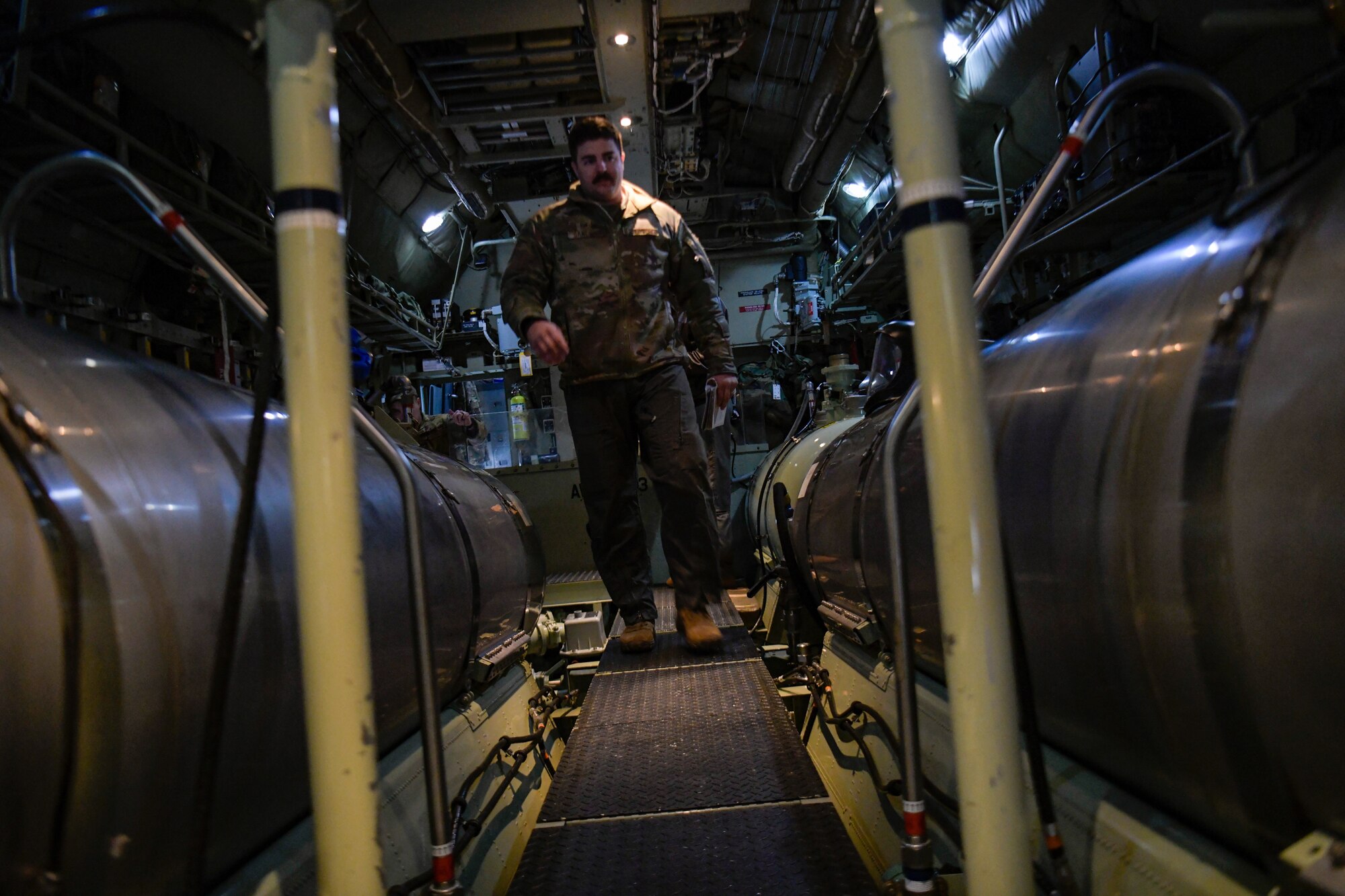 Tech. Sgt. Ethan Sanchez, an aerial spray qualified loadmaster assigned to the 757th Airlift Squadron, runs preflight checks on a modular aerial spray system aboard an aerial spray modified C-130H Hercules aircraft assigned to the 910th Airlift Wing, Youngstown Air Reserve Station, Ohio, on March 14, 2023, at Hill Air Force Base, Utah.