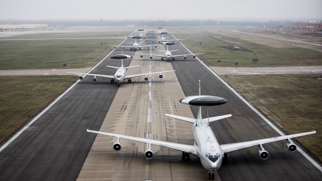 E-3G Sentry aircraft assigned to the 552nd Air Control Wing line up on Runway 18 at Tinker Air Force Base, Oklahoma, March 21, 2023. The weather flush gives air crews, support squadrons and maintainers a chance to practice generating the E-3G Sentry to evacuate the area quickly in the event of a weather emergency. Constant training ensures Airmen are ready to provide support command, control and communication to support multi-domain operations worldwide. (U.S. Air Force photo by Paul Shirk)