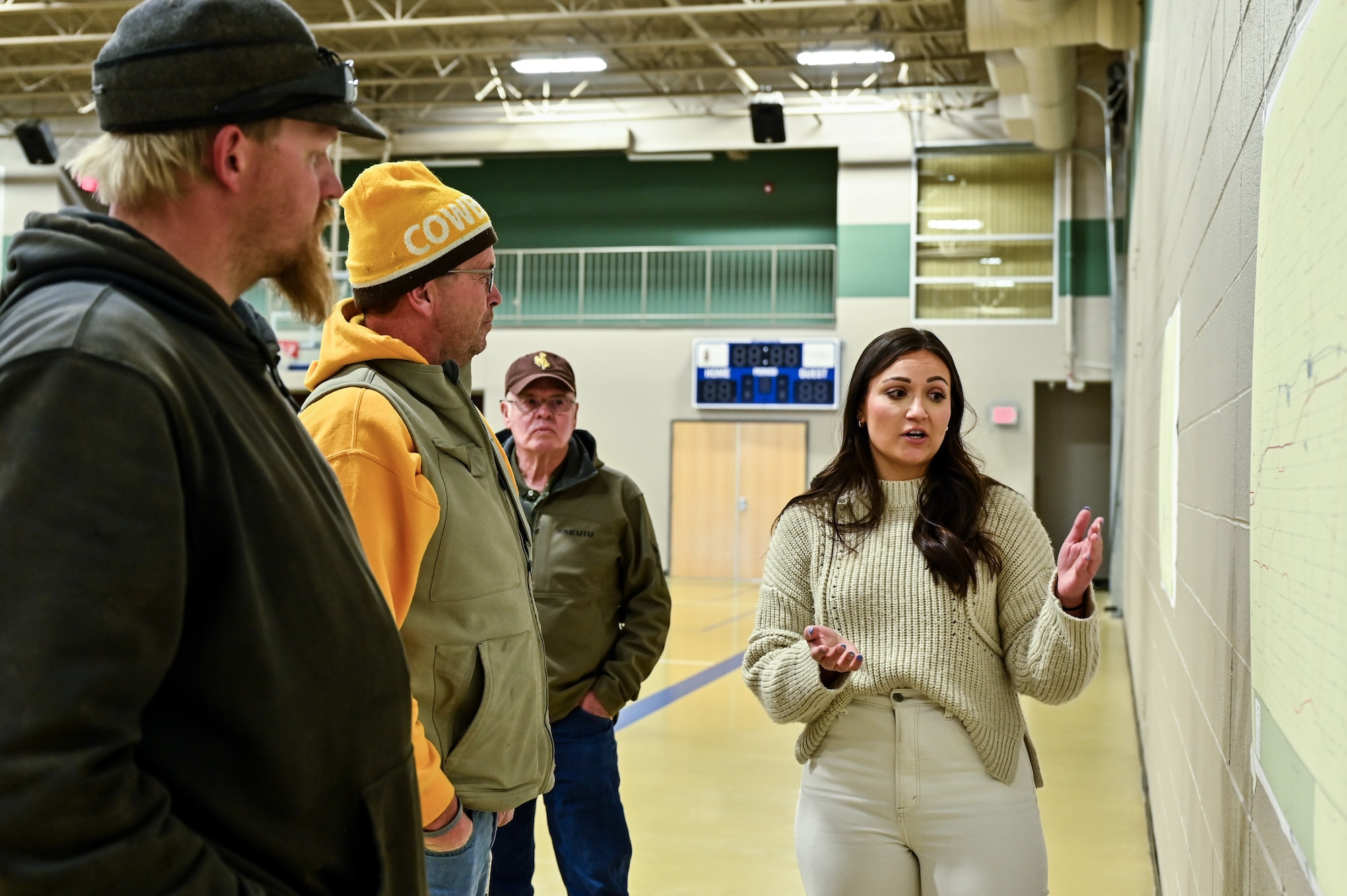 Paige Staroscik, U.S. Army Corp of Engineers senior realty specialist, talks with landowners during a town meeting in Pine Bluffs, Wyoming, March 27, 2023. The U.S. Air Force and the U.S. Corps of Engineers host a Sentinel town meeting for Laramie County landowners to discuss real estate activities and future negotiations to support the project. The Air Force discussed the temporary construction easements for utility corridors and launch facilities and missile alert facilities conversion; the new permanent easements for utility corridors; drainage easements for LF and MAF sites converted to the new Sentinel Launch Centers; road access to new tower sites; and fee acquisitions for five-acre tower sites. (U.S. Air Force photos by Joseph Coslett Jr.)