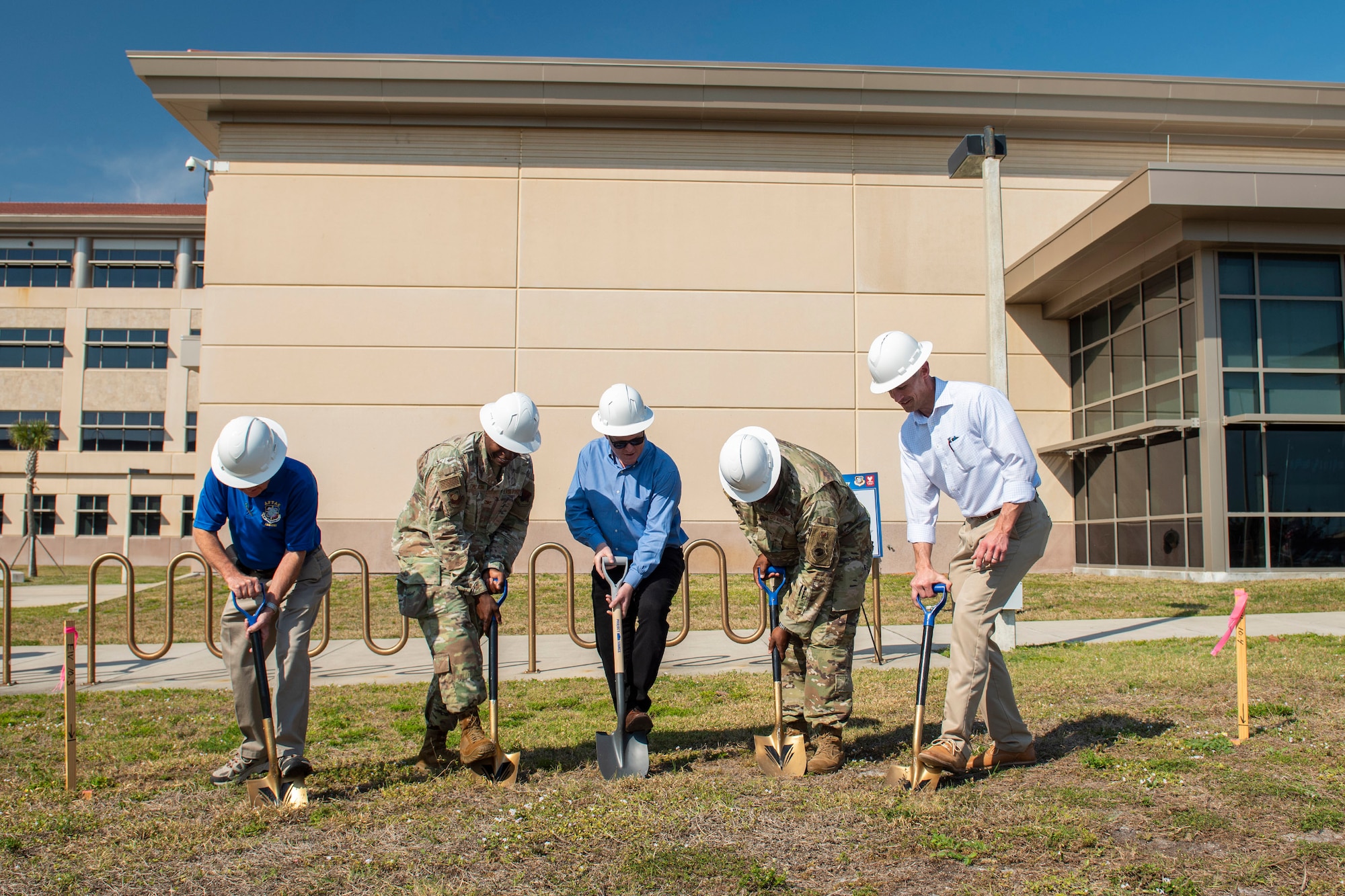 A team of leaders from the Air Force Technical Applications Center, Viera Builders, The Viera Company, Space Launch Delta 45, and the AFTAC Memorial Corporation use shovels to turn symbolically break ground for the new AFTAC Memorial at Patrick Space Force Base, Fla., Feb. 24, 2023.  The memorial will pay tribute to AFTAC personnel who lost their lives while in active government service..  Pictured are:  Lou Seiler, AFTAC Memorial Corp.; Col James A. Finlayson, AFTAC commander; Todd Pokrywa, The Viera Company president; Col. Anthony Graham, SLD 45 vice commander; and Nick Crowe, Viera Builders executive vice president.  (U.S. Air Force photo by Matthew S. Jurgens)