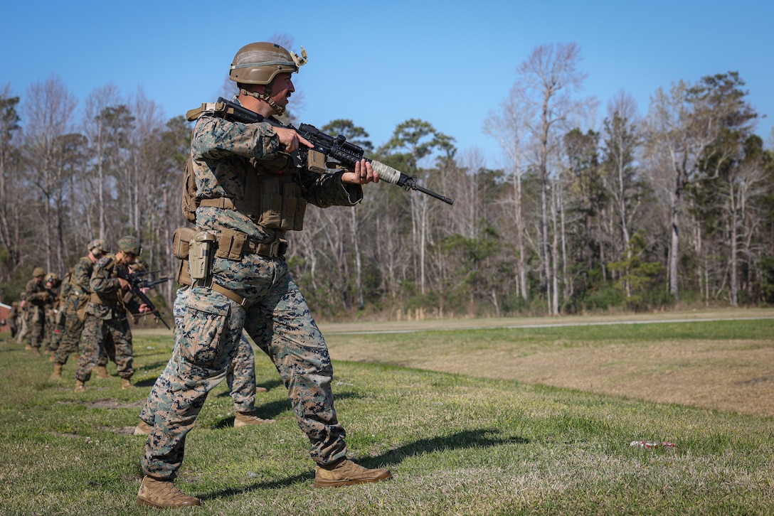 U.S. Marine Corps Cpl. Kyle Tirpak, a combat marksmanship trainer instructor with Weapons Training Battalion, Marine Corps Base (MCB) Camp Lejeune, prepares to fire his weapon during the 2023 Marine Corps Marksmanship Competition East on Stone Bay, MCB Camp Lejeune, North Carolina, March 7, 2023. All Marines east of the Mississippi were invited to attend this annual competition to increase their combat effectiveness and lethality using MCB Camp Lejeune's premier ranges. (U.S. Marine Corps photo by Cpl. Jennifer E. Douds)
