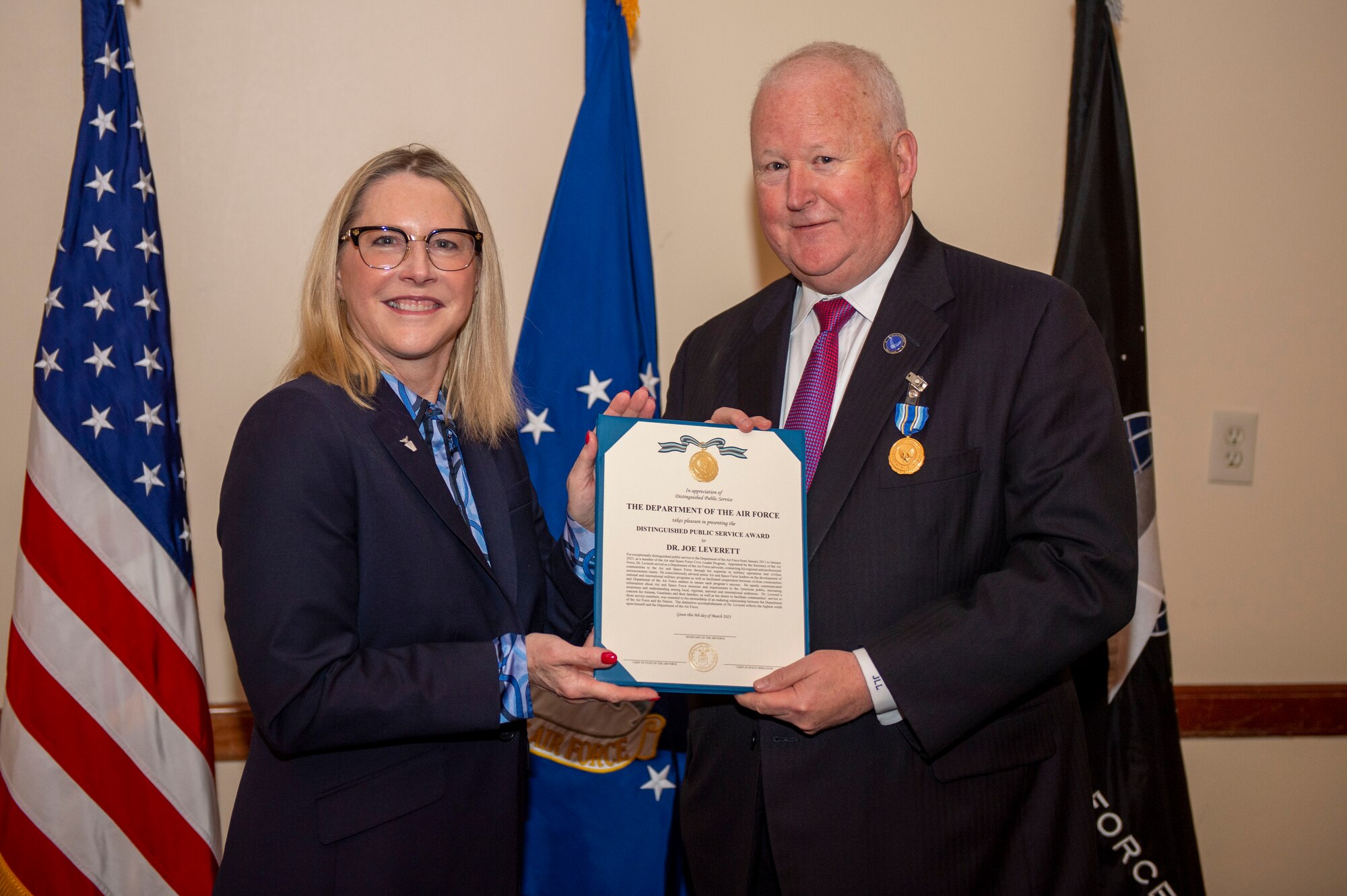 Dr. Lisa Costa, the U.S. Space Force Chief Technology and Innovation Officer, awards the Department of the Air Force Distinguished Public Service Award to Dr. Joe Leverett, chairman of the Altus Military Affairs Committee, during an Air Force and Space Force civic leader award ceremony at Andrews Air Force Base, Maryland, March 9, 2023. Leverett was appointed by the Secretary of the Air Force for the Air and Space Force Civic Leader program in 2011 to act as an advocate and advisor on how to best accomplish the Air Force’s mission within his local area. (U.S. Air Force photo by Staff Sgt. Adam R. Shanks)