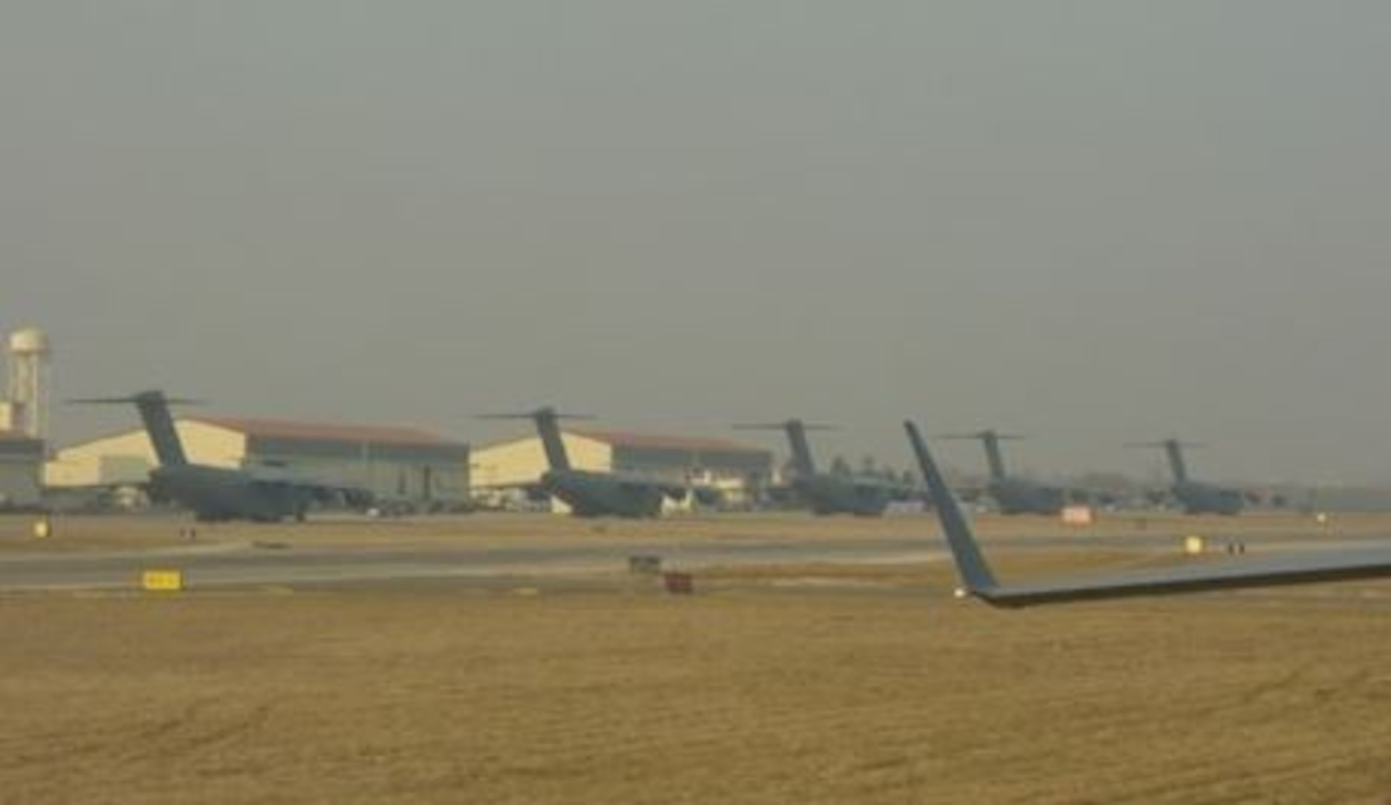 C-17 Globemaster IIIs prepare to take off from Aviano Air Base, Italy, in early 2003. (Courtesy Photo)