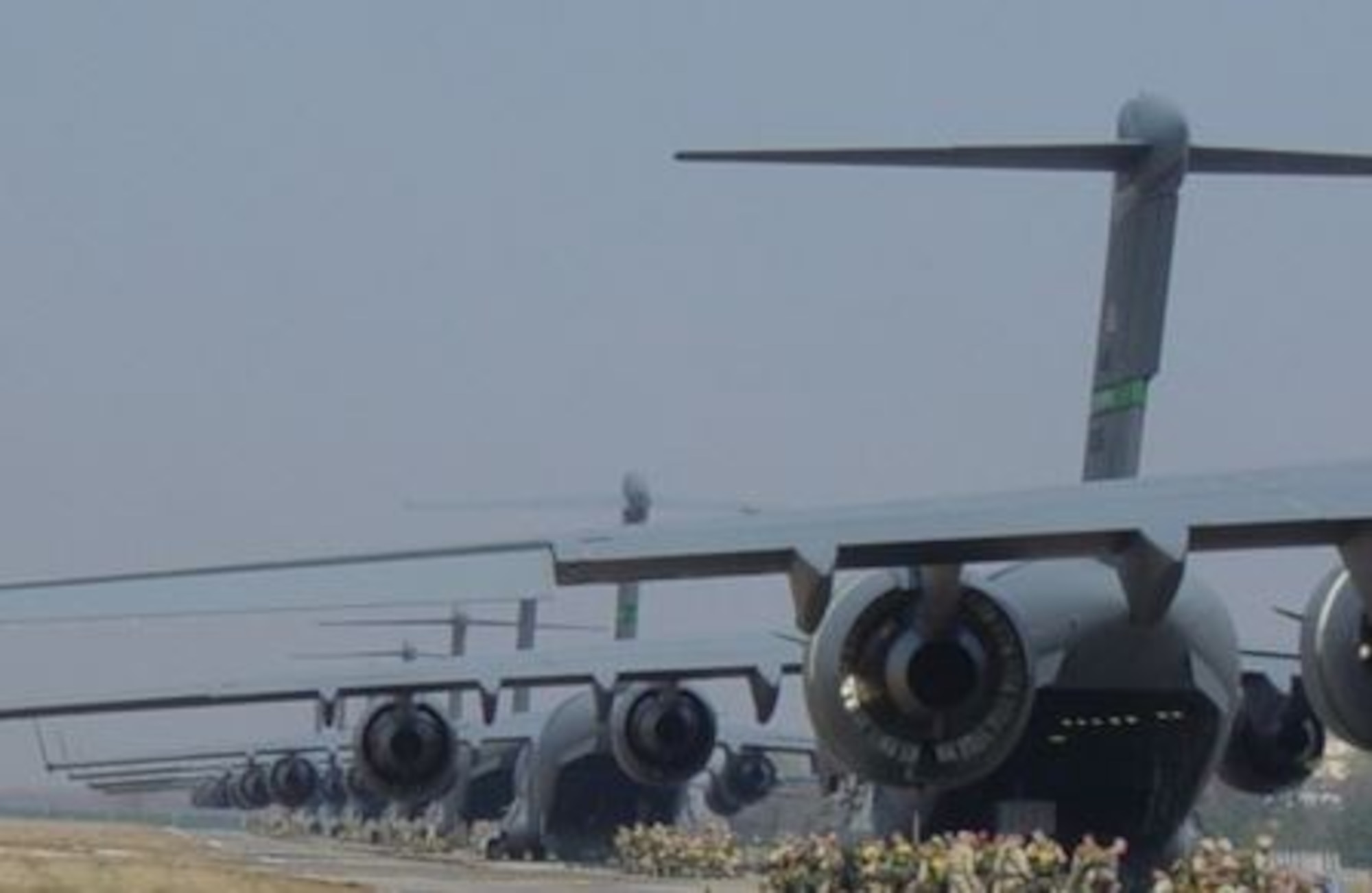 Paratroopers with the 173rd Airborne Brigade prepare to board a C-17 Globemaster III for a jump near Bashur Airfield, Iraq, in early 2003. (Courtesy Photo)