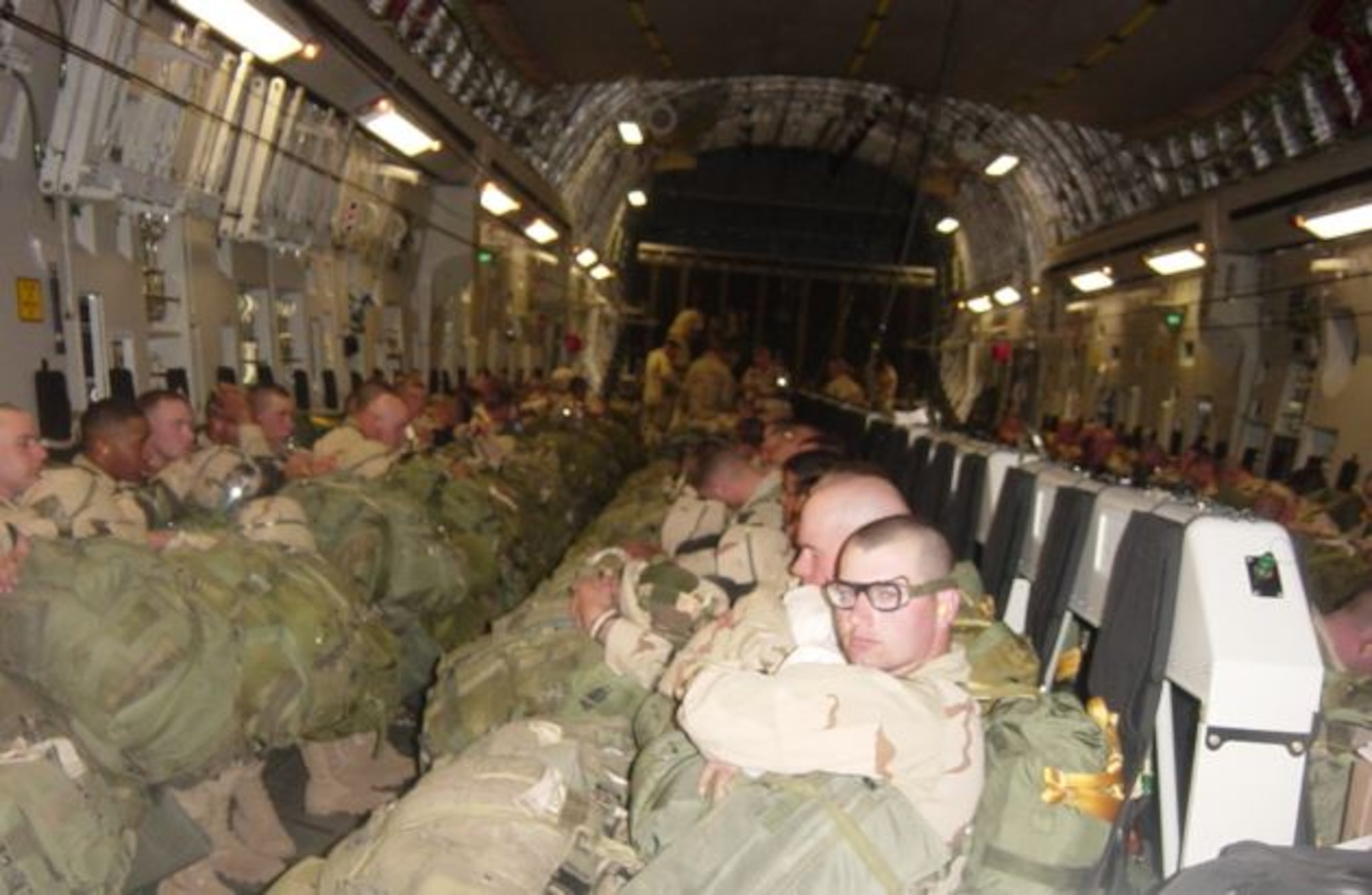 Paratroopers with the 173rd Airborne Brigade fly on a C-17 Globemaster III to their jump destination near Bashur Airfield, Iraq, in early 2003. (Courtesy Photo)