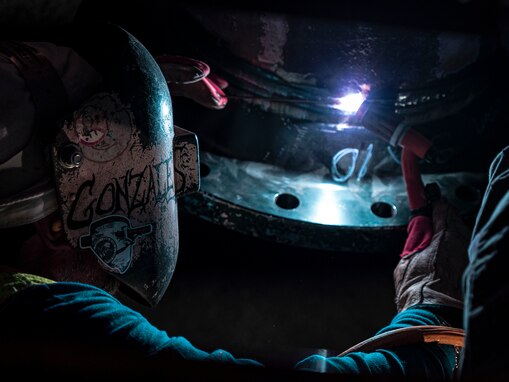 A Red Hill Bulk Fuel Storage Facility (RHBFSF) contractor welds a fuel pipe during repairs at Halawa, Hawaii, March 23, 2023. Joint Task Force-Red Hill is in phase three of its five-phase defueling plan where task force personnel are focused on completing repairs, quality control tasks, training and response preparation, the National Environmental Protection Act (NEPA) Environmental Assessment (EA), regulatory approvals and operational planning for such things as dewatering, repacking, and defueling to ensure a safe and expeditious defueling of the RHBFSF. (U.S. Navy photo by Mass Communication Specialist 2nd Class James Finney)