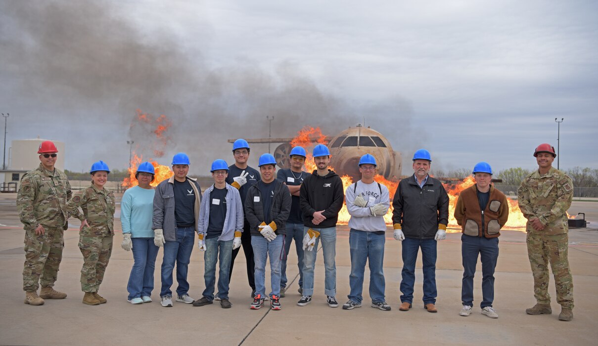 Local U.S. Air Force recruiting prospects and 312th Training Squadron instructors pose for a photo at the Louis F. Garland Department of Defense Fire Academy, Texas, March 29, 2023. This community outreach initiative allowed prospects to ask Air Force related questions and learn about different jobs in the Air Force. (U.S. Air Force photo by Senior Airman Ashley Thrash)