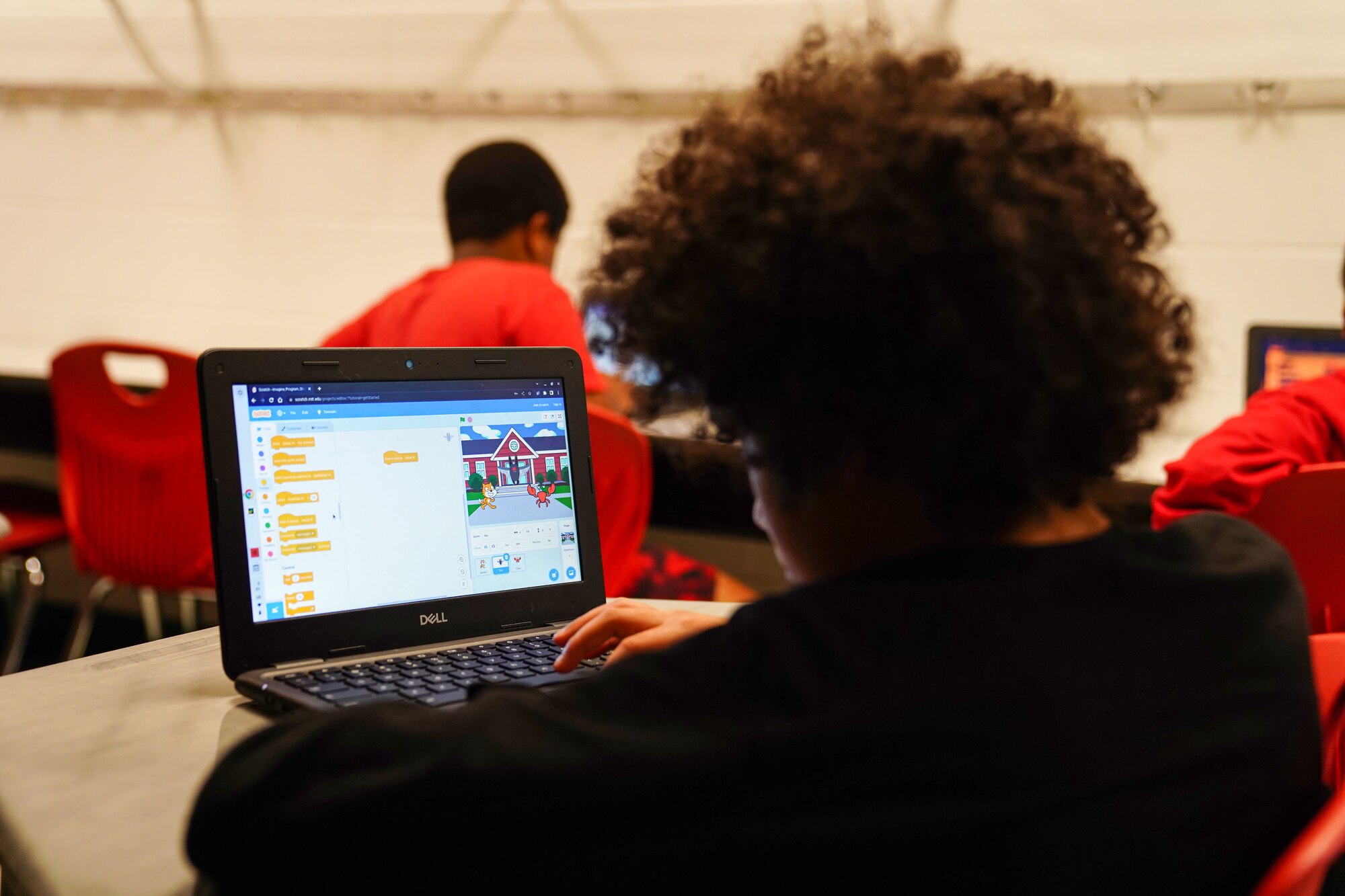 A Back Bay Elementary student creates basic algorithm blocks at Back Bay Elementary School on March 23, 2023. The 336 TRS collaborated with Back Bay Elementary to teach 4th grade students the basics of programing through a seven week course.